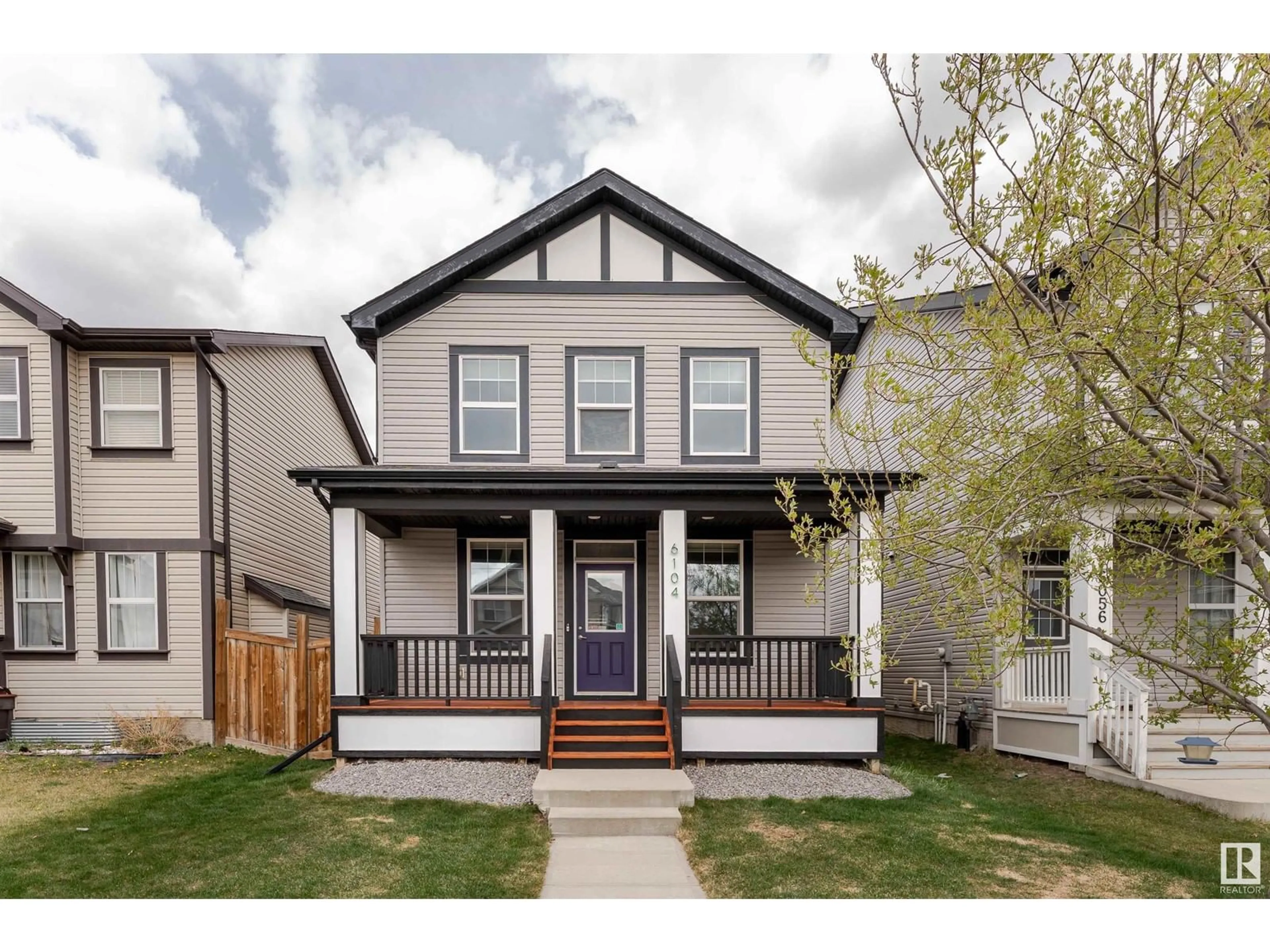 Home with vinyl exterior material, street for NW - 6104 176 AV, Edmonton Alberta T5Y3N9