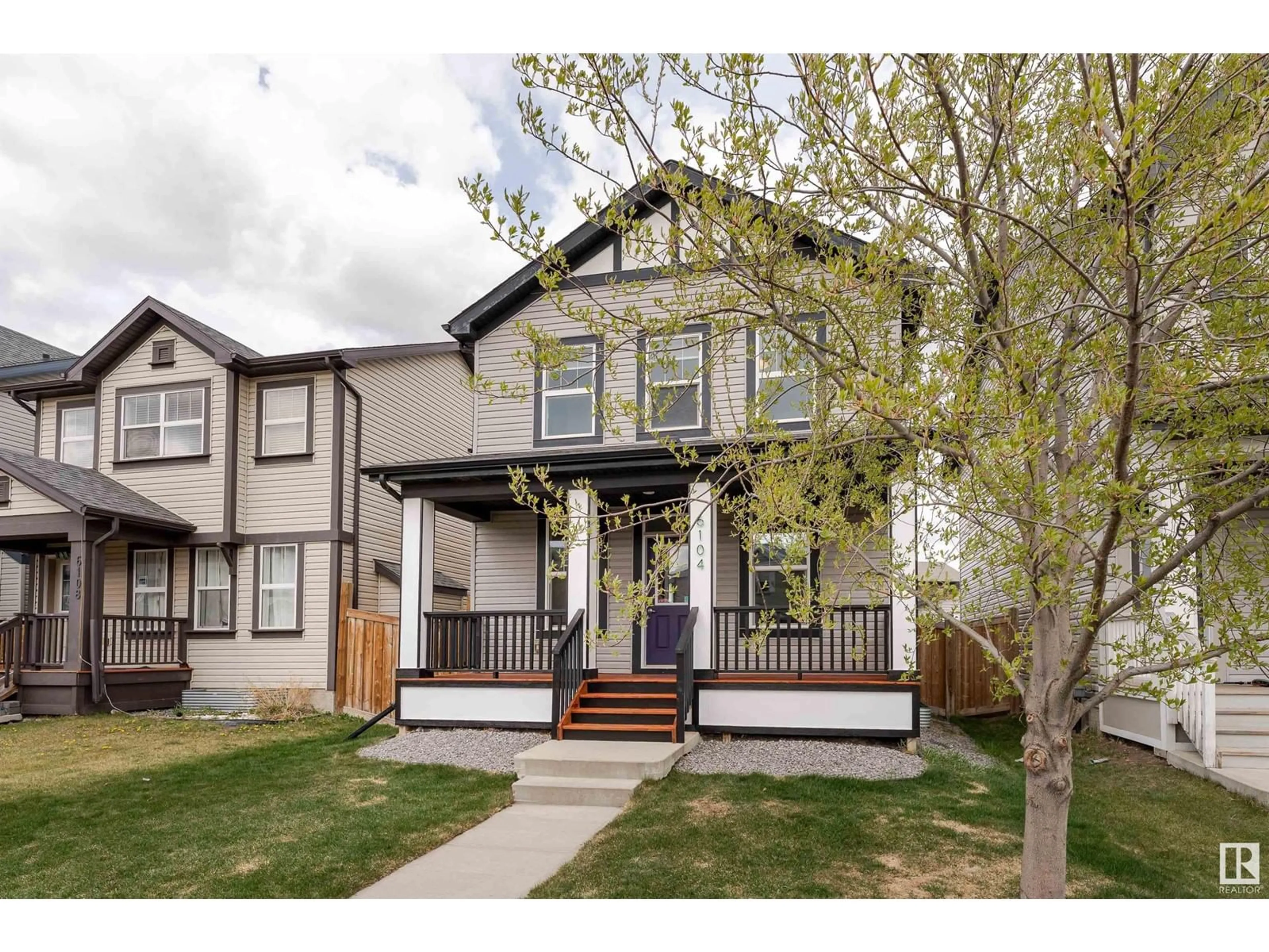 Home with vinyl exterior material, street for NW - 6104 176 AV, Edmonton Alberta T5Y3N9