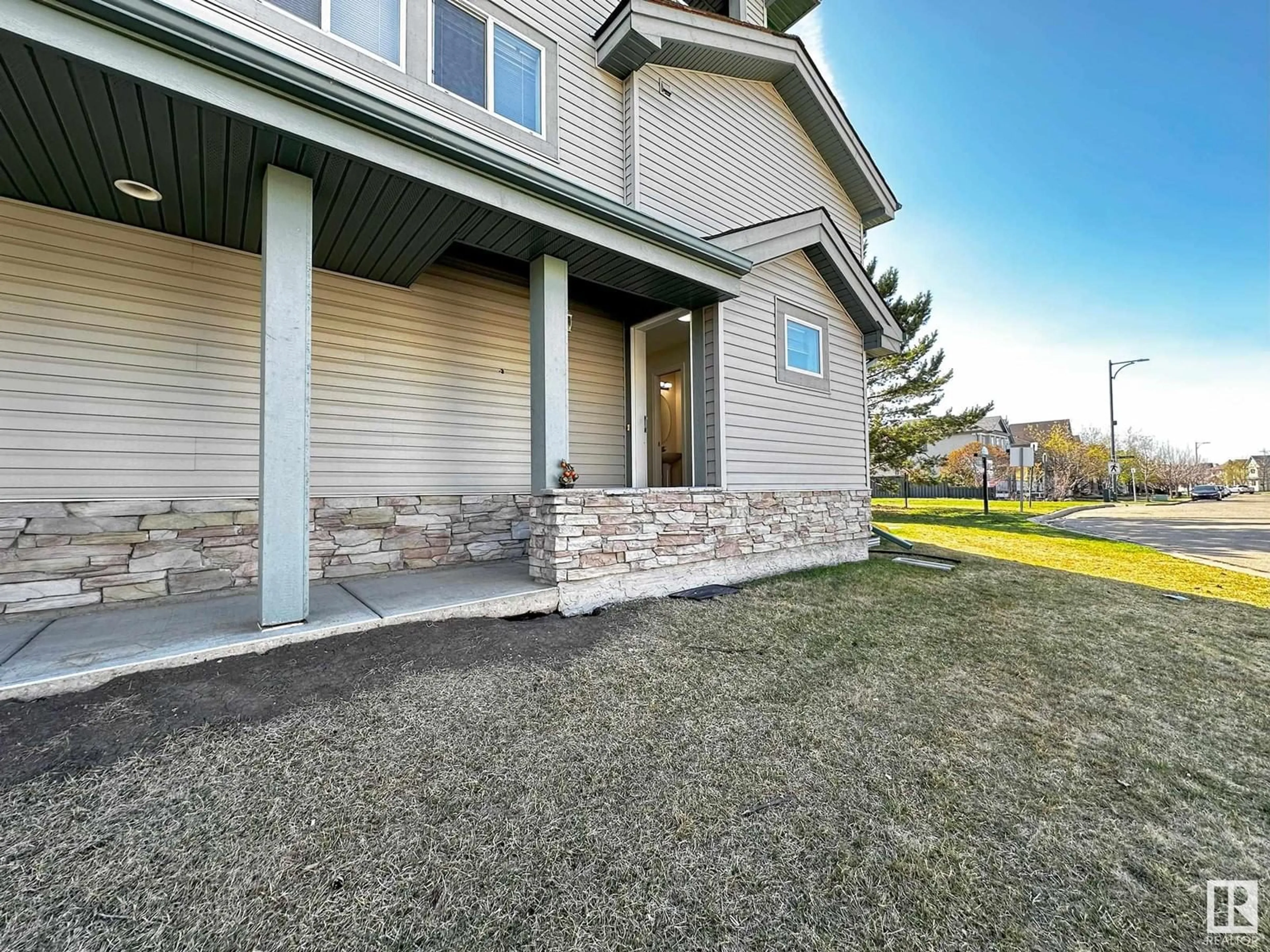 Home with vinyl exterior material, street for #124 - 12050 17 AV, Edmonton Alberta T6W1X4