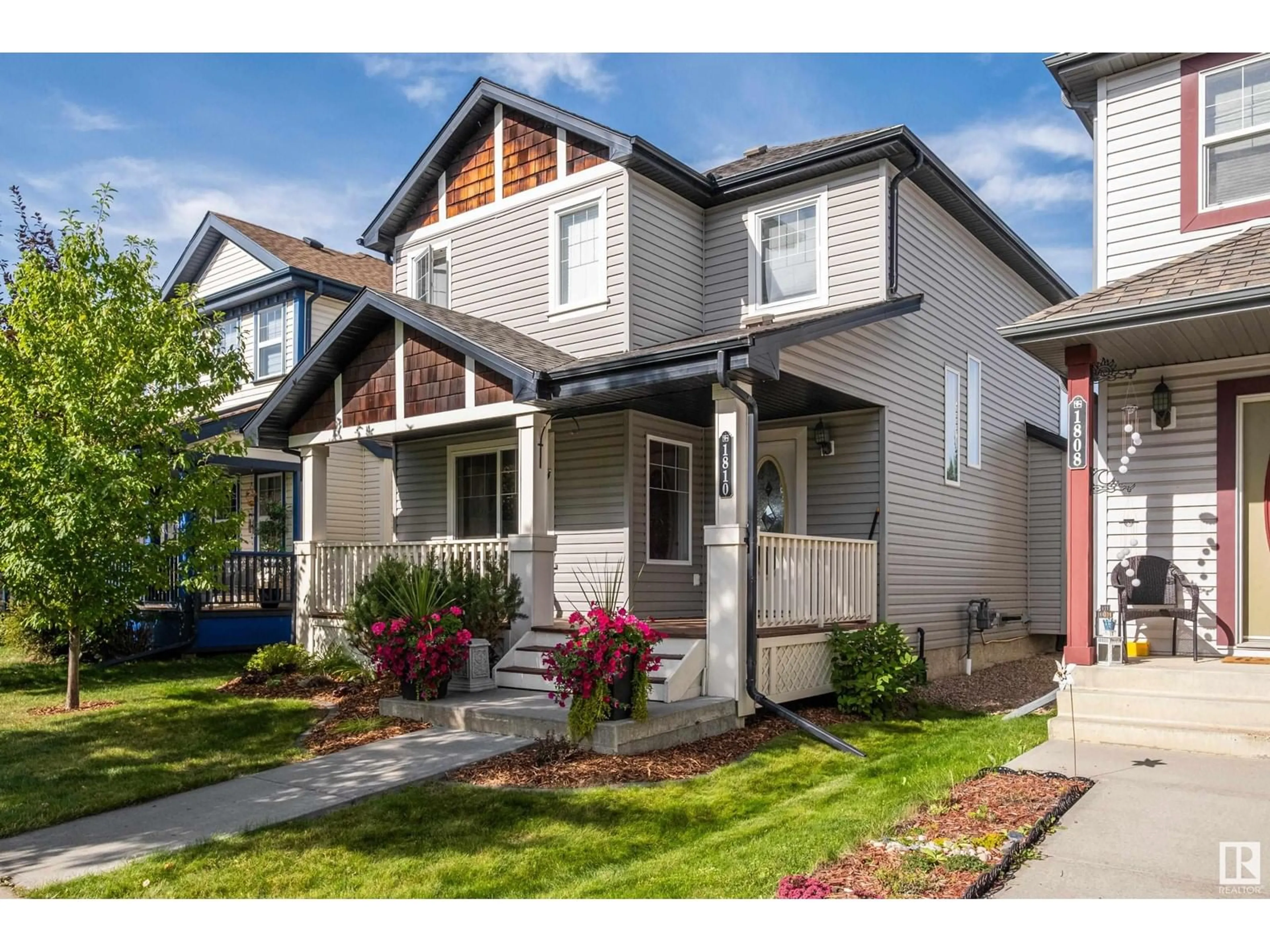 Home with vinyl exterior material, street for 1810 121 ST, Edmonton Alberta T6W1T5