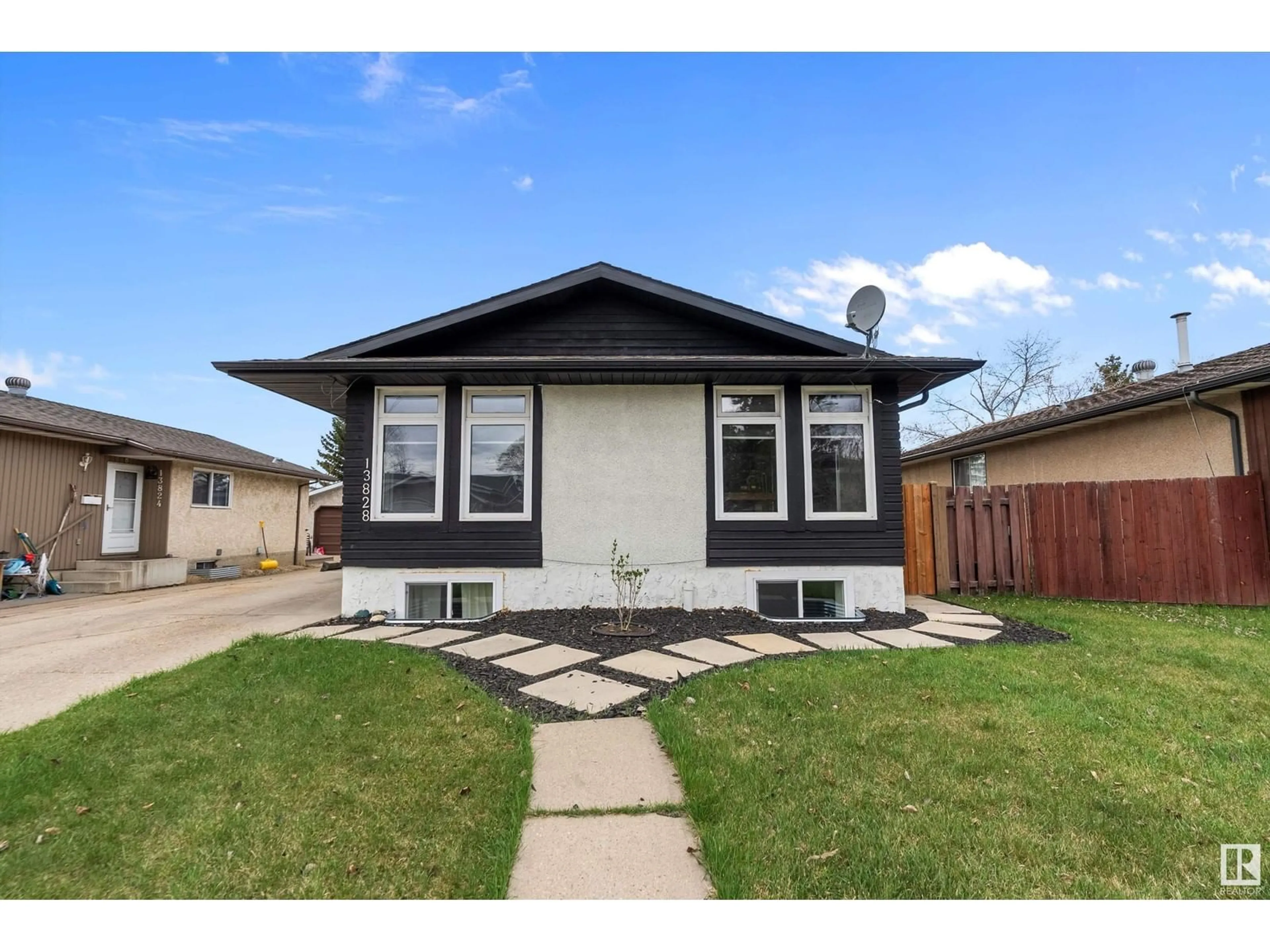 Home with vinyl exterior material, street for 13828 28 ST, Edmonton Alberta T5Y1A7