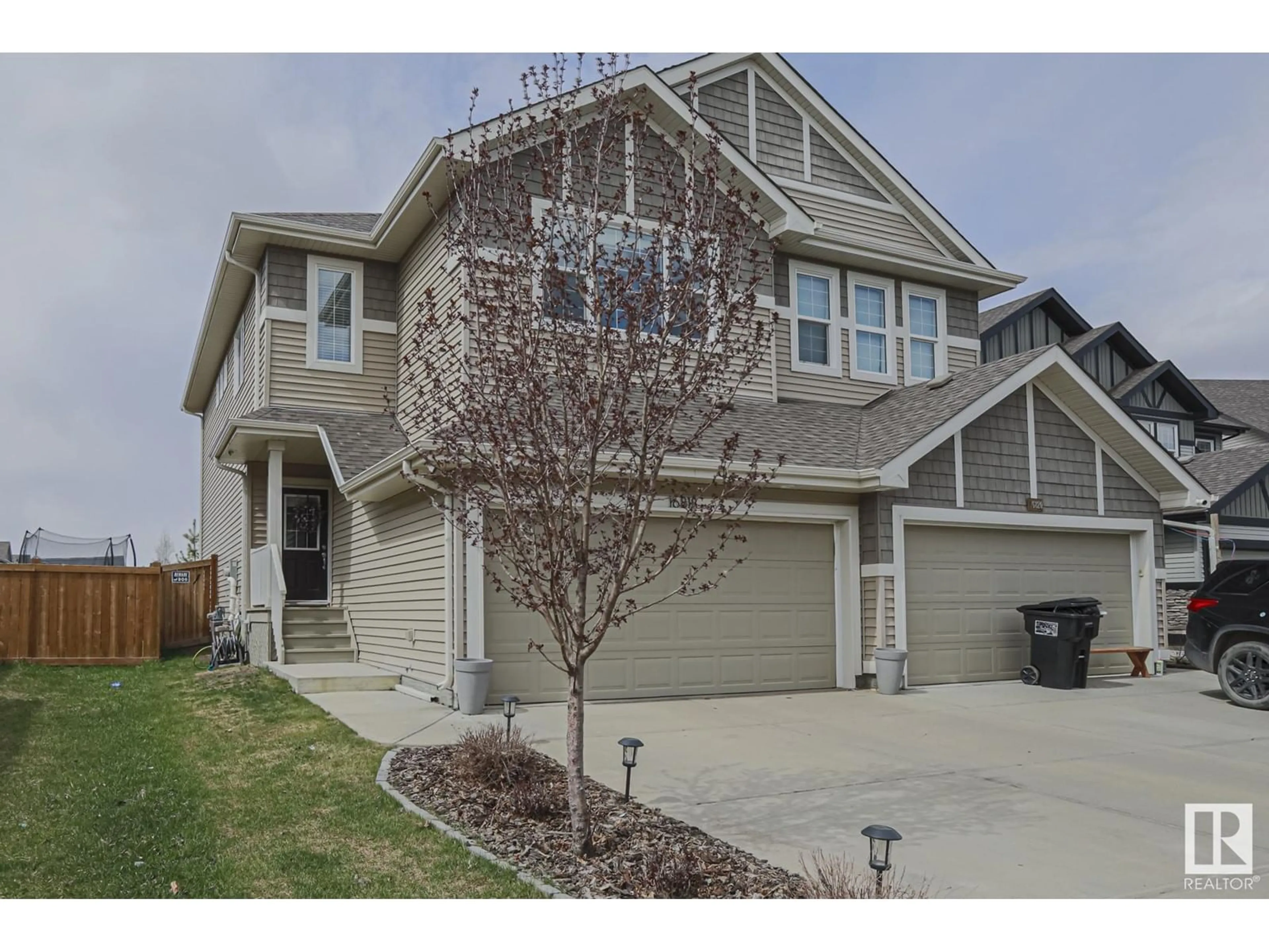 Home with vinyl exterior material, street for 16818 65 ST, Edmonton Alberta T5Y3W6
