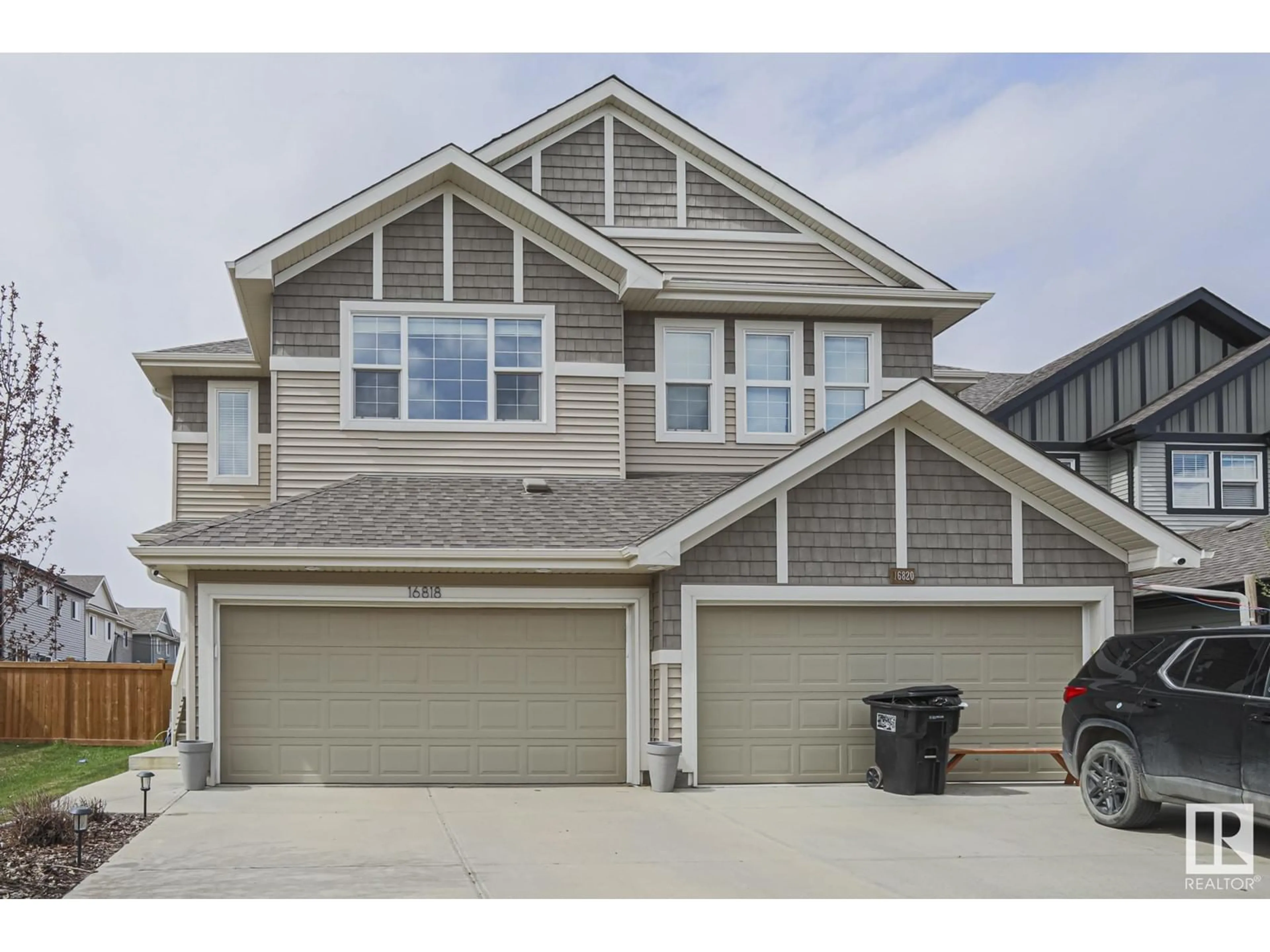 Home with vinyl exterior material, street for 16818 65 ST, Edmonton Alberta T5Y3W6