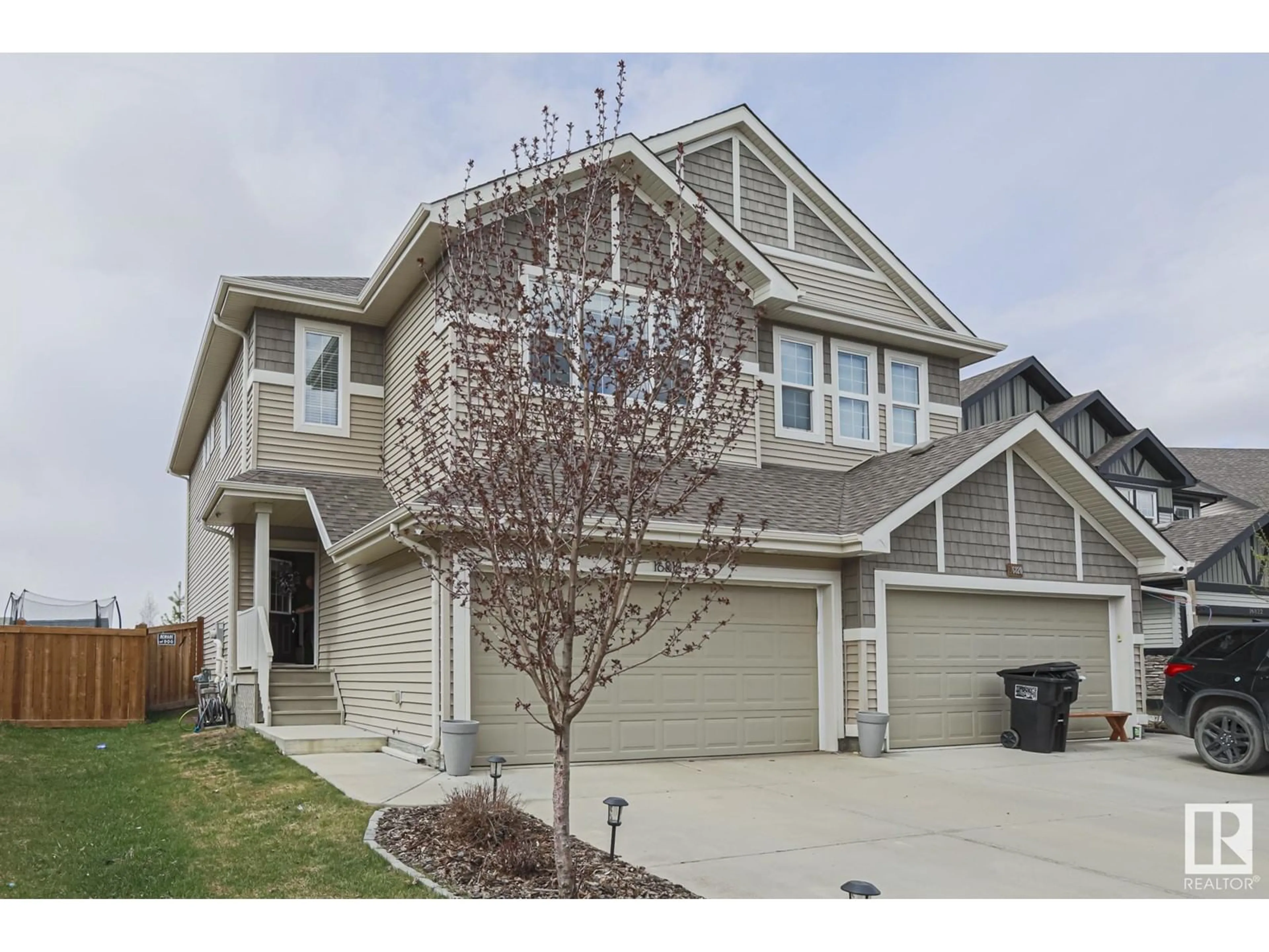 Home with vinyl exterior material, street for 16818 65 ST, Edmonton Alberta T5Y3W6