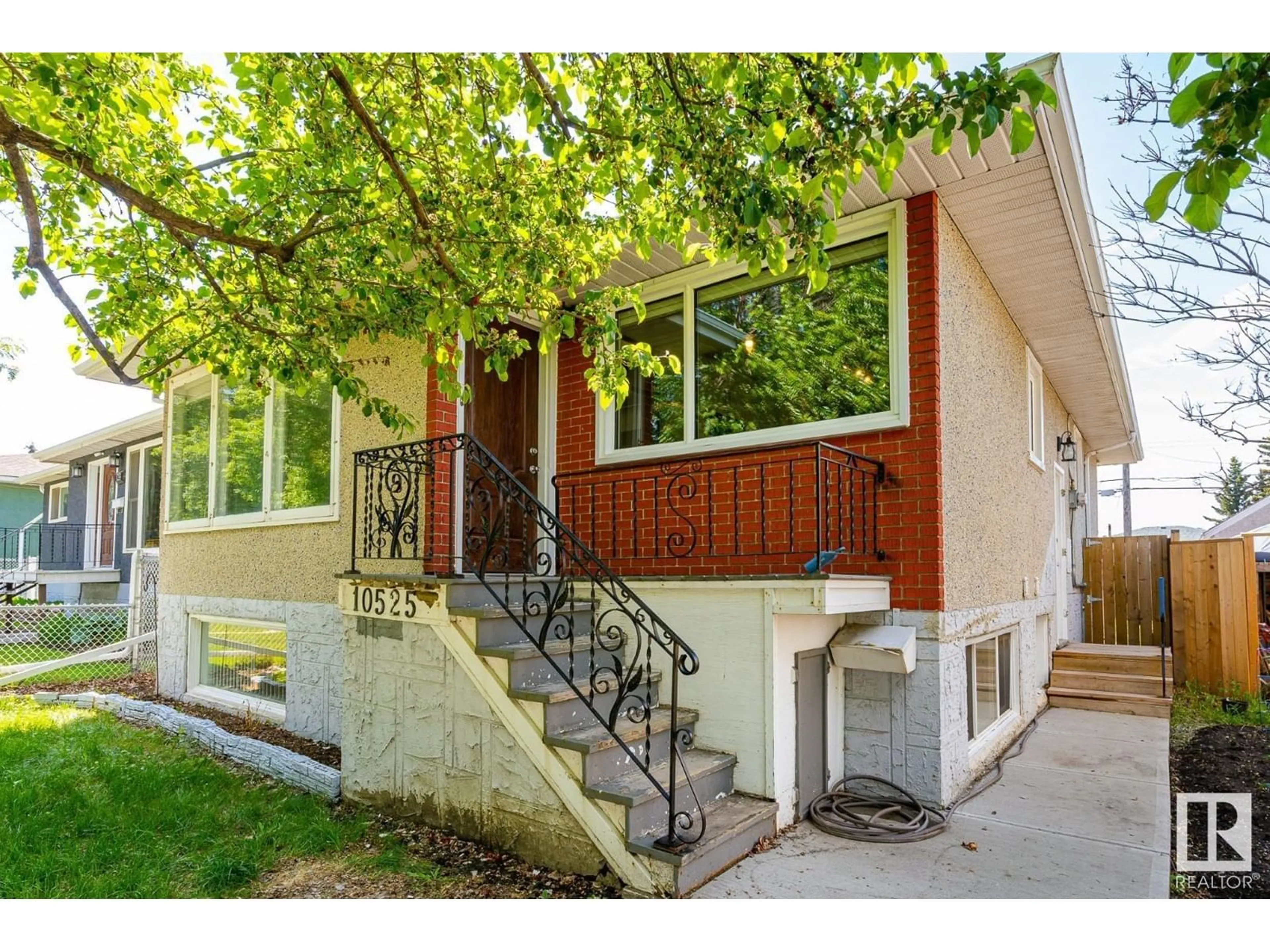 Home with vinyl exterior material, street for 10525 63 AV, Edmonton Alberta T6H1P5