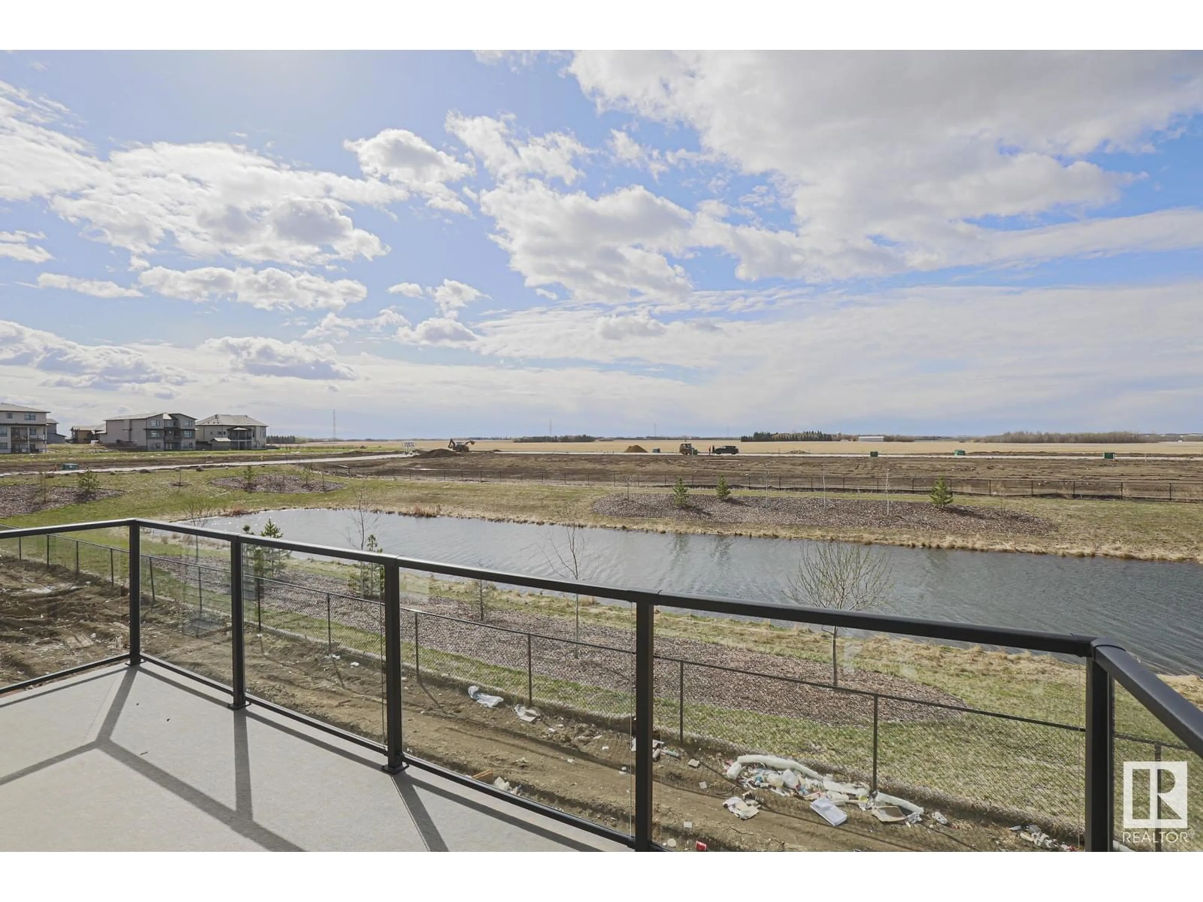 A pic from outside/outdoor area/front of a property/back of a property/a pic from drone, water/lake/river/ocean view for 2731 63 AVE, Rural Leduc County Alberta T4X3A6