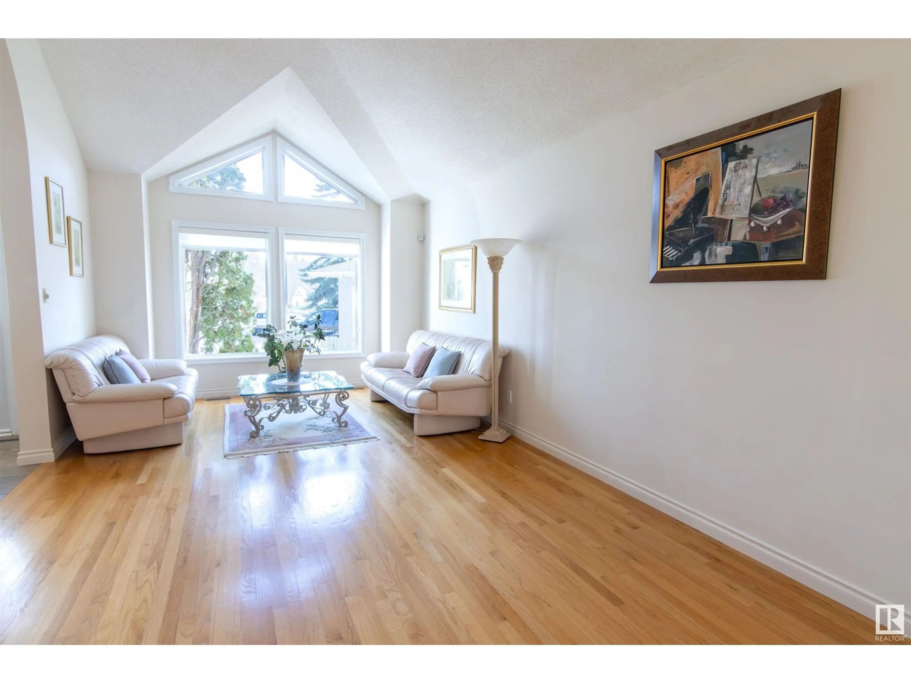 Living room with furniture, wood/laminate floor for NW - 5224 186 ST, Edmonton Alberta T6M2G4