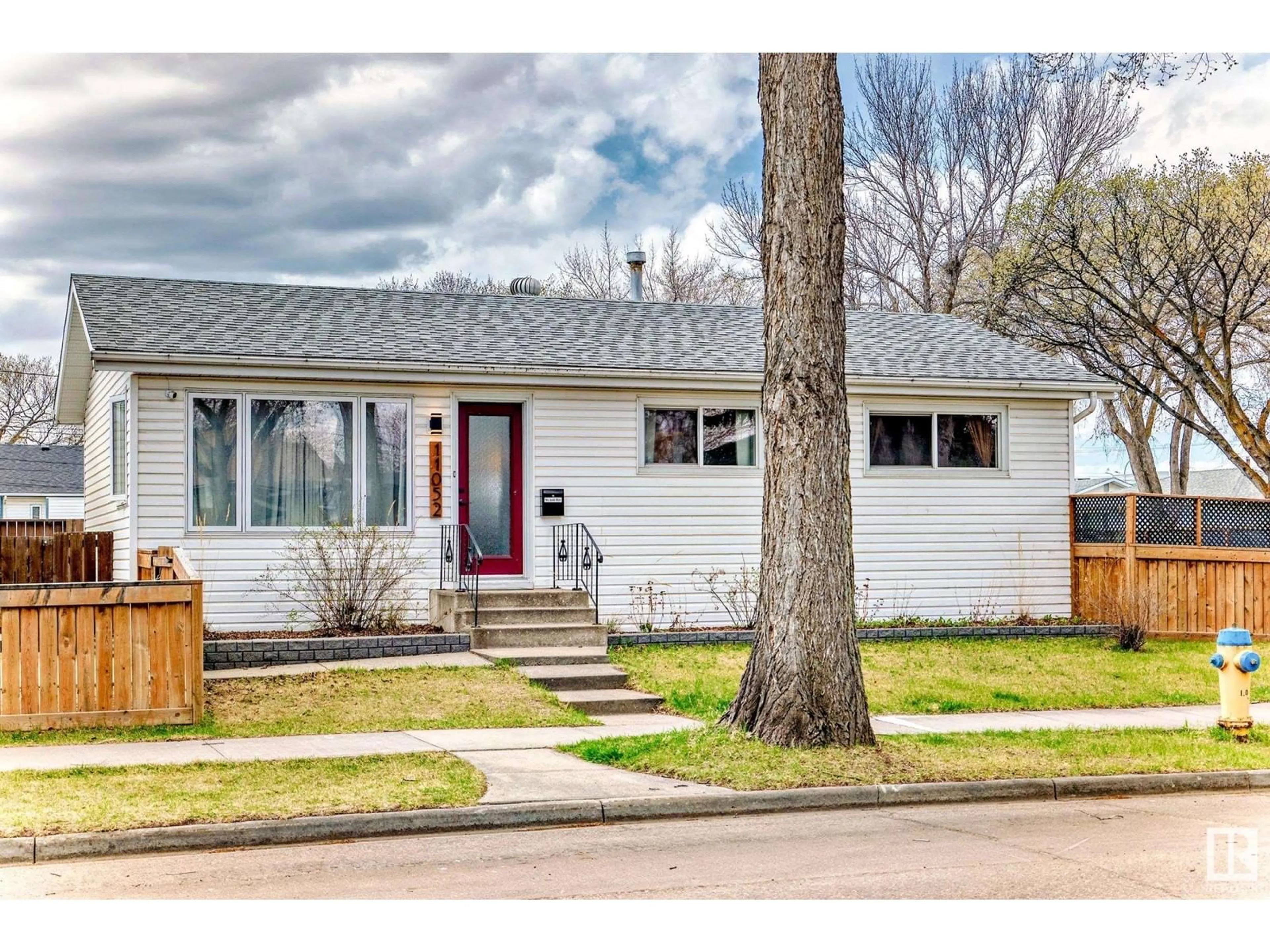Home with vinyl exterior material, street for 11052 151 ST, Edmonton Alberta T5P1W3