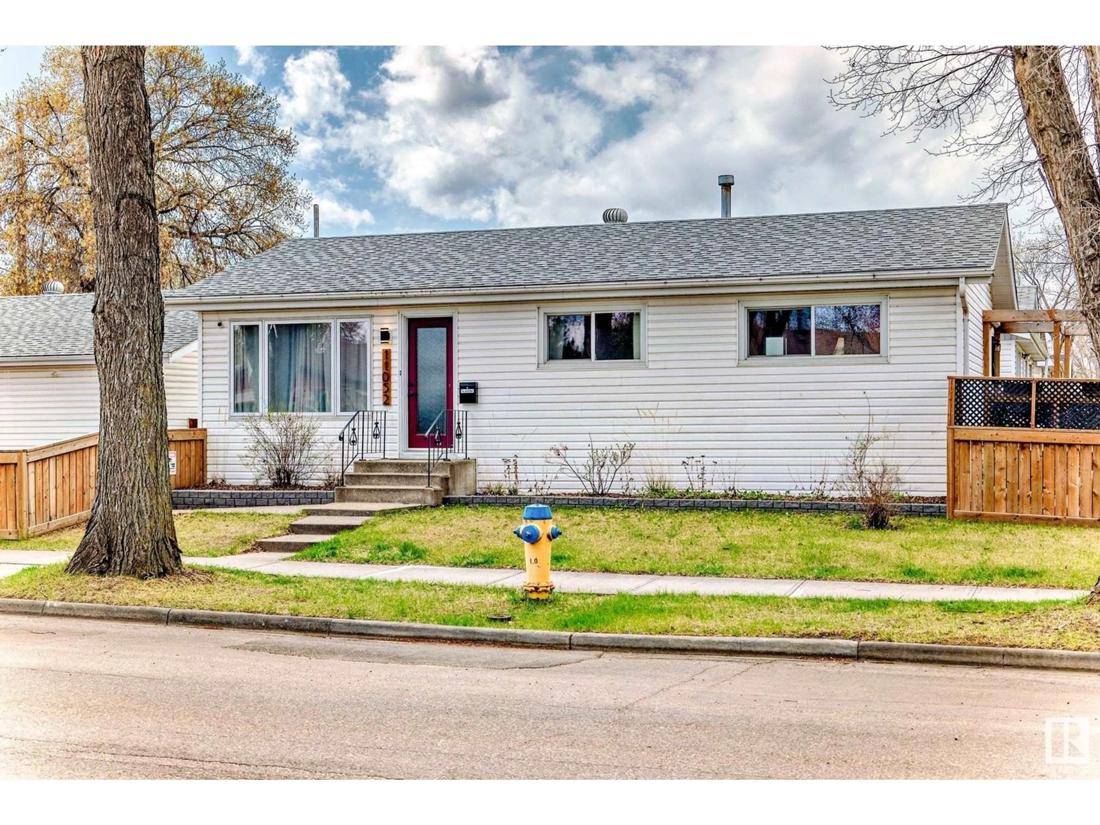 Home with vinyl exterior material, street for 11052 151 ST, Edmonton Alberta T5P1W3