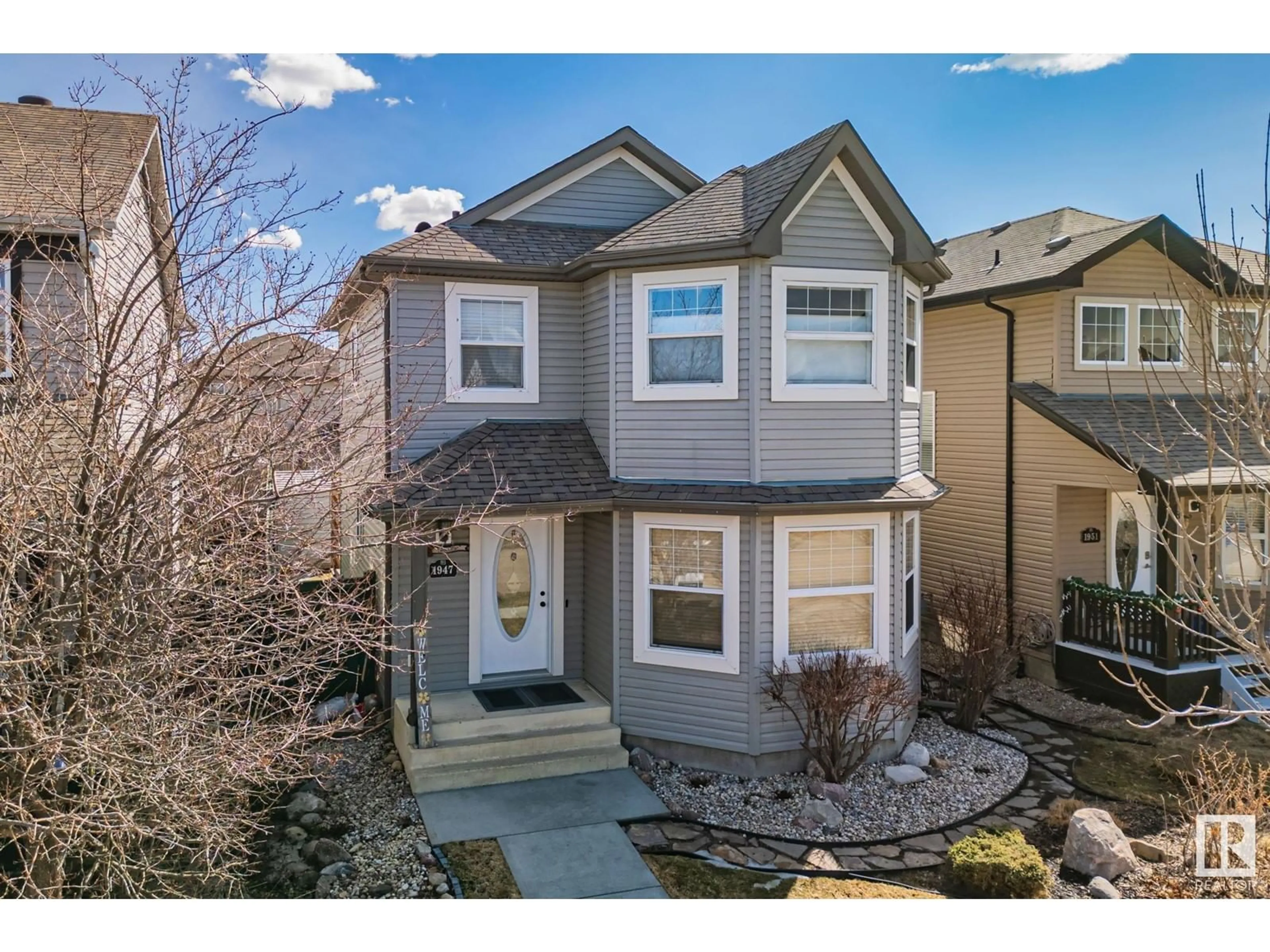 Home with vinyl exterior material, street for 1947 119 ST, Edmonton Alberta T6W0E3