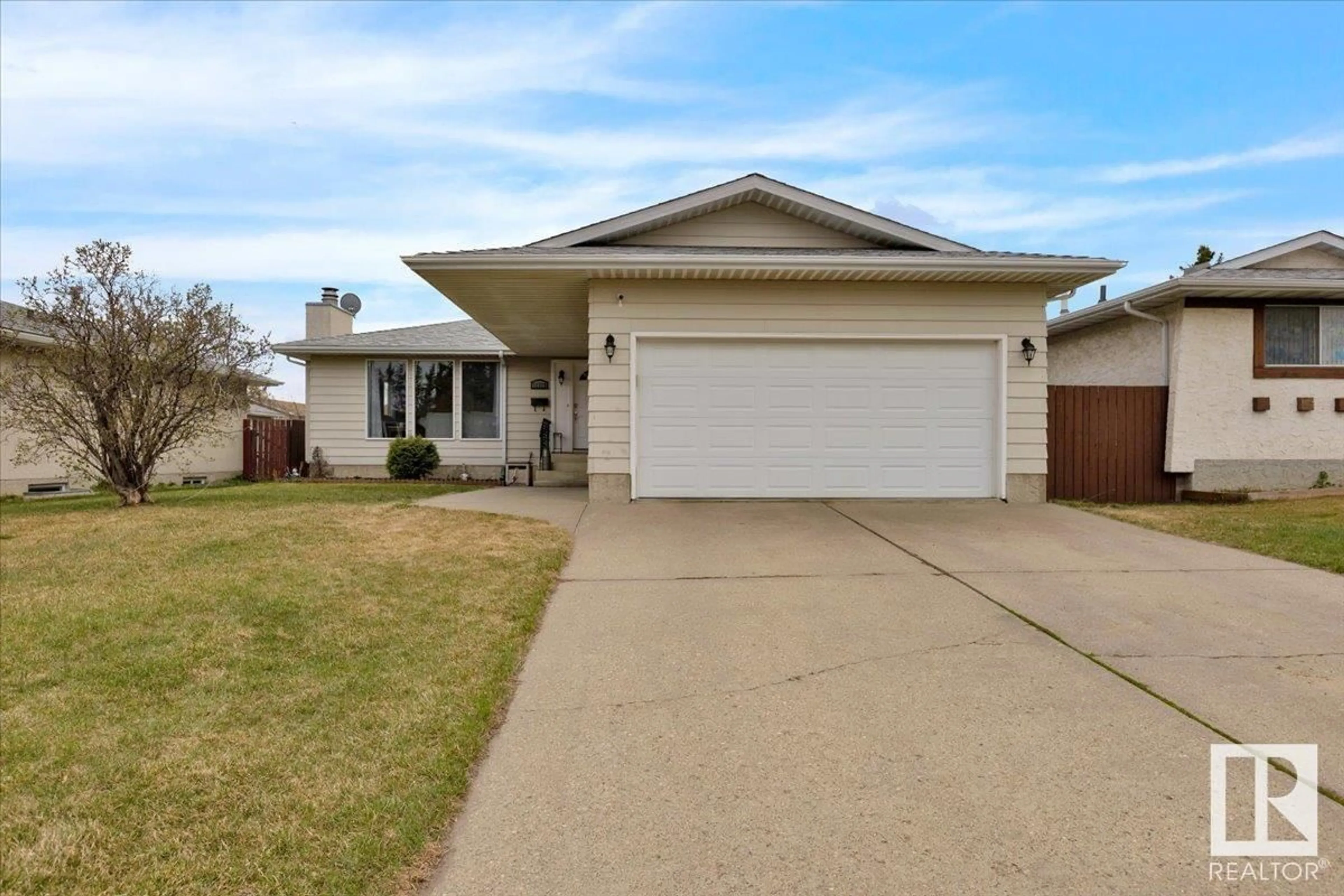 Home with vinyl exterior material, street for 11719 158 AV, Edmonton Alberta T5X2K3