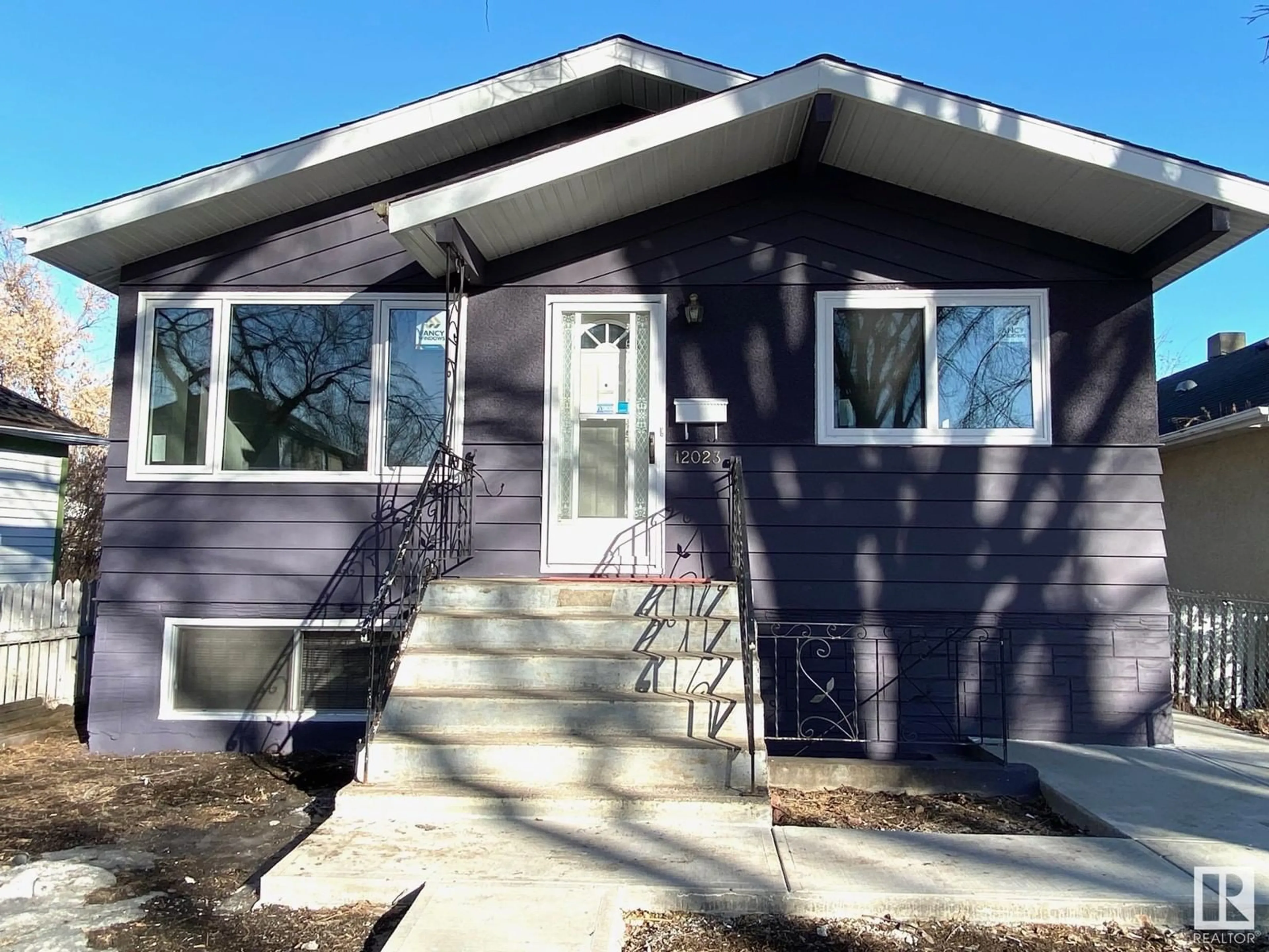 Home with vinyl exterior material, street for NW - 12023 93 ST, Edmonton Alberta T5G1G7