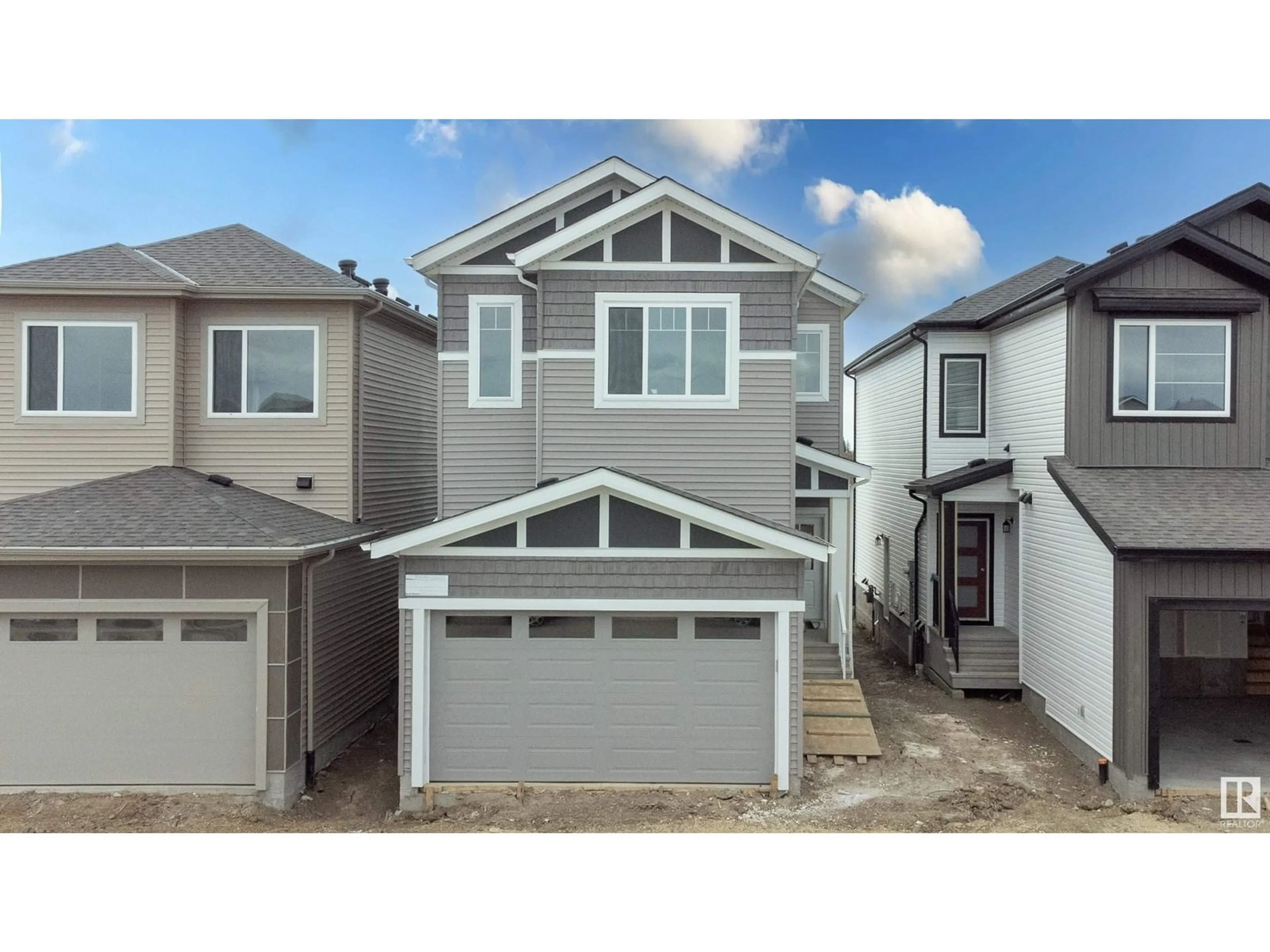 Home with vinyl exterior material, street for 2040 210 ST, Edmonton Alberta T6M3H6