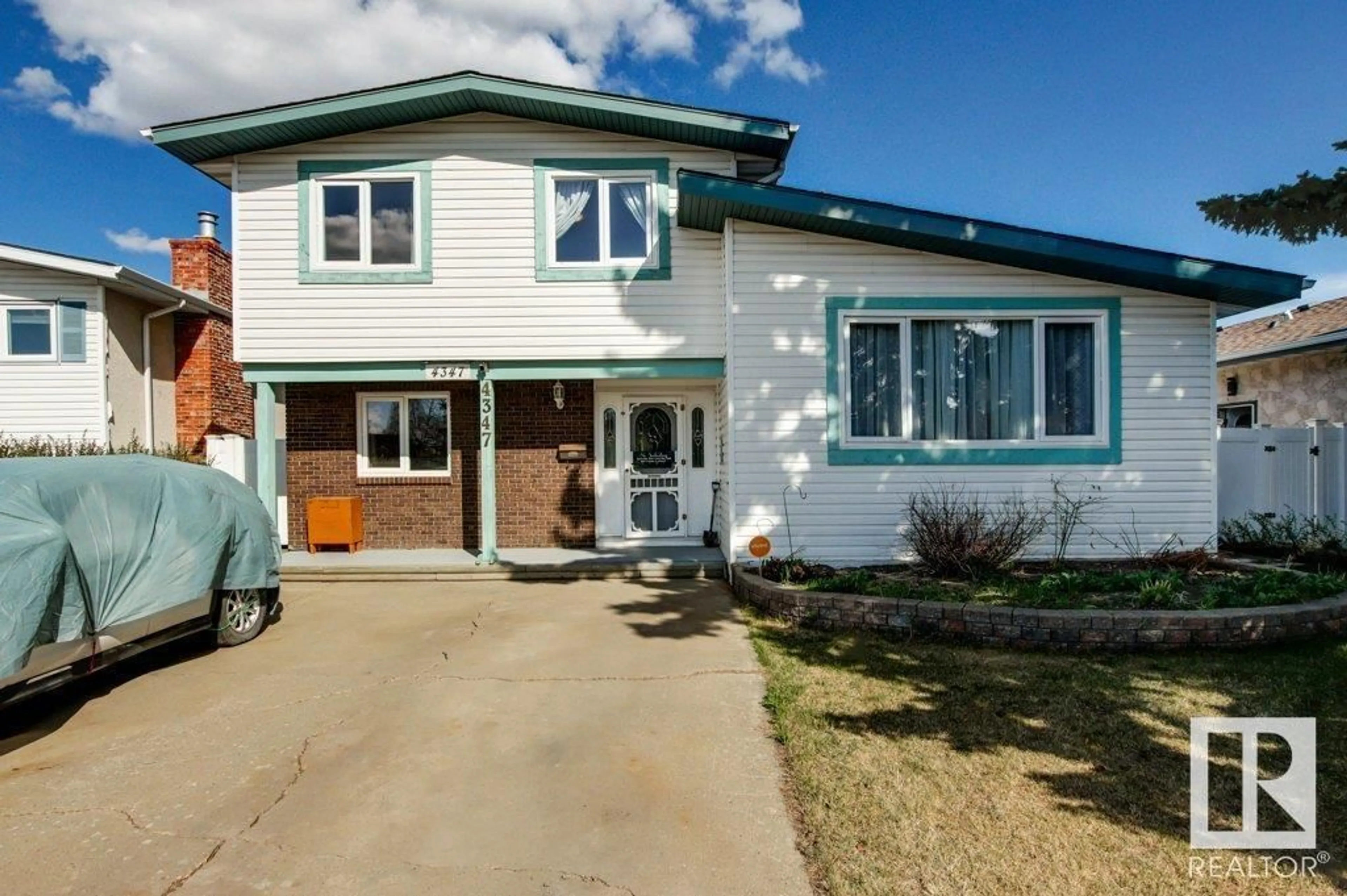 Home with vinyl exterior material, street for 4347 68 ST, Edmonton Alberta T6K0T7