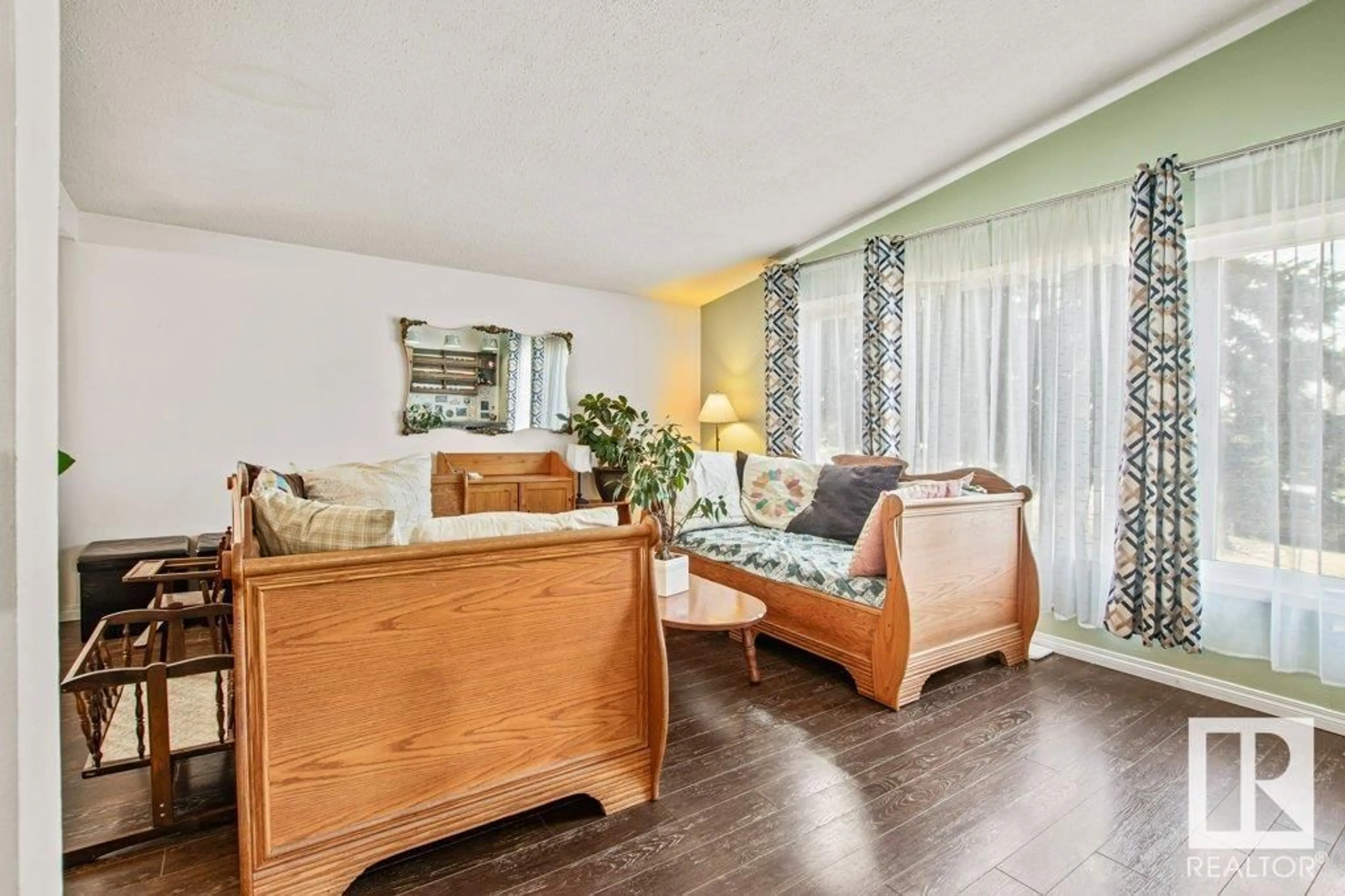 Living room with furniture, wood/laminate floor for 4347 68 ST, Edmonton Alberta T6K0T7