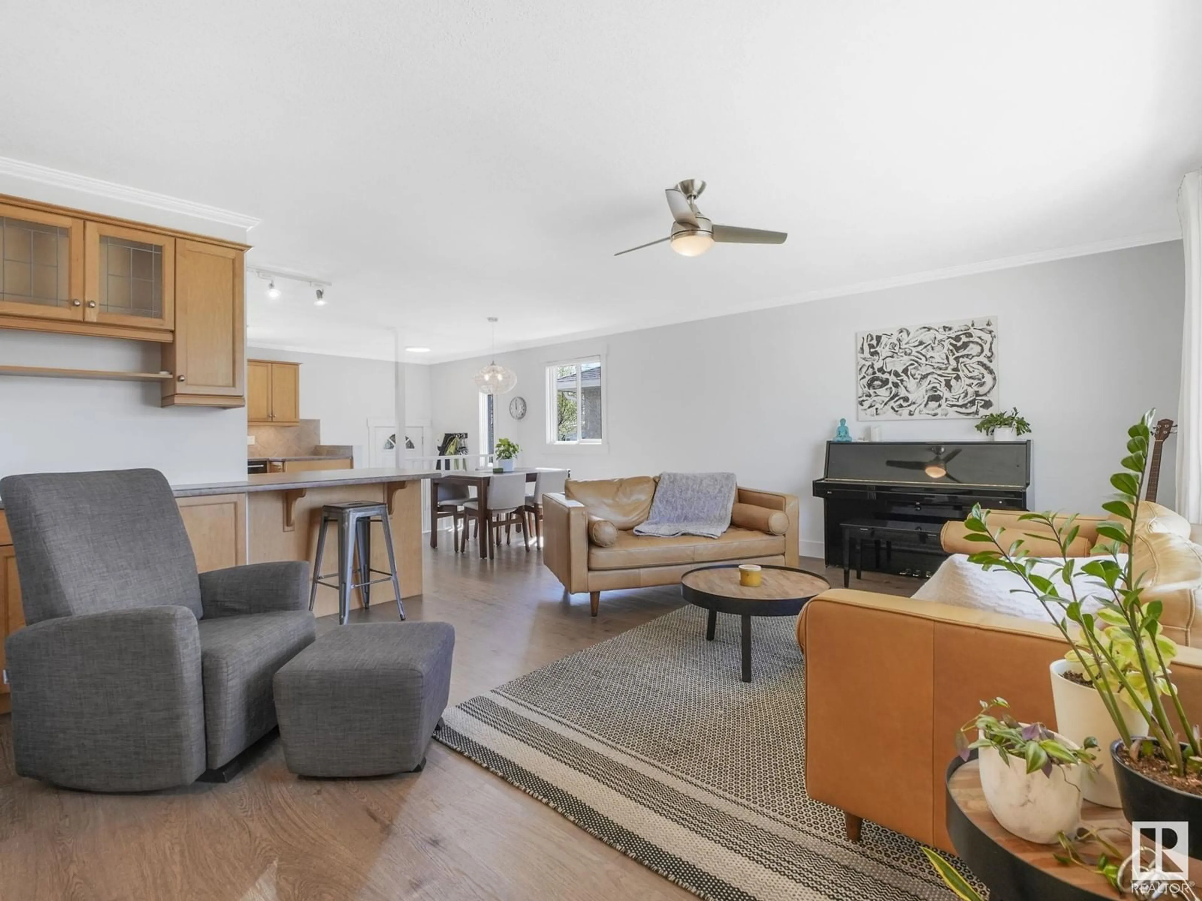 Living room with furniture, wood/laminate floor for NW - 9607 77 ST, Edmonton Alberta T6C2M7