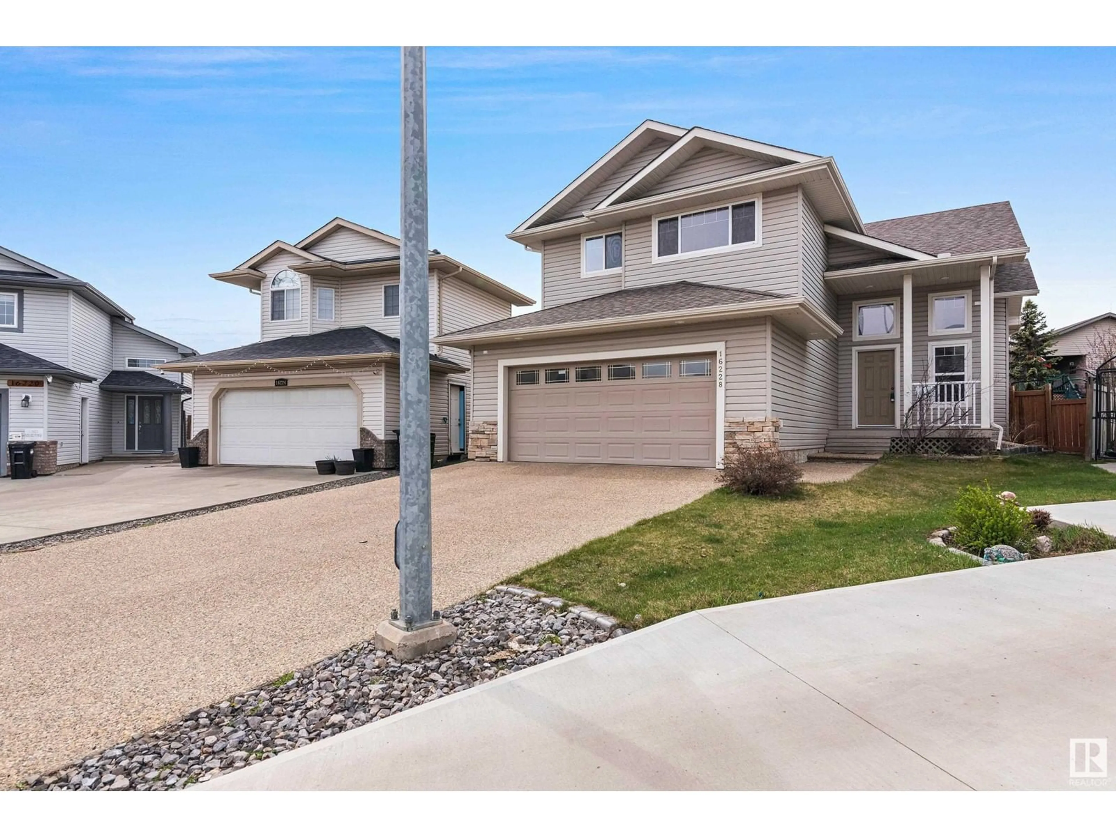 Home with vinyl exterior material, street for NW - 16228 51 ST, Edmonton Alberta T5Y3K2