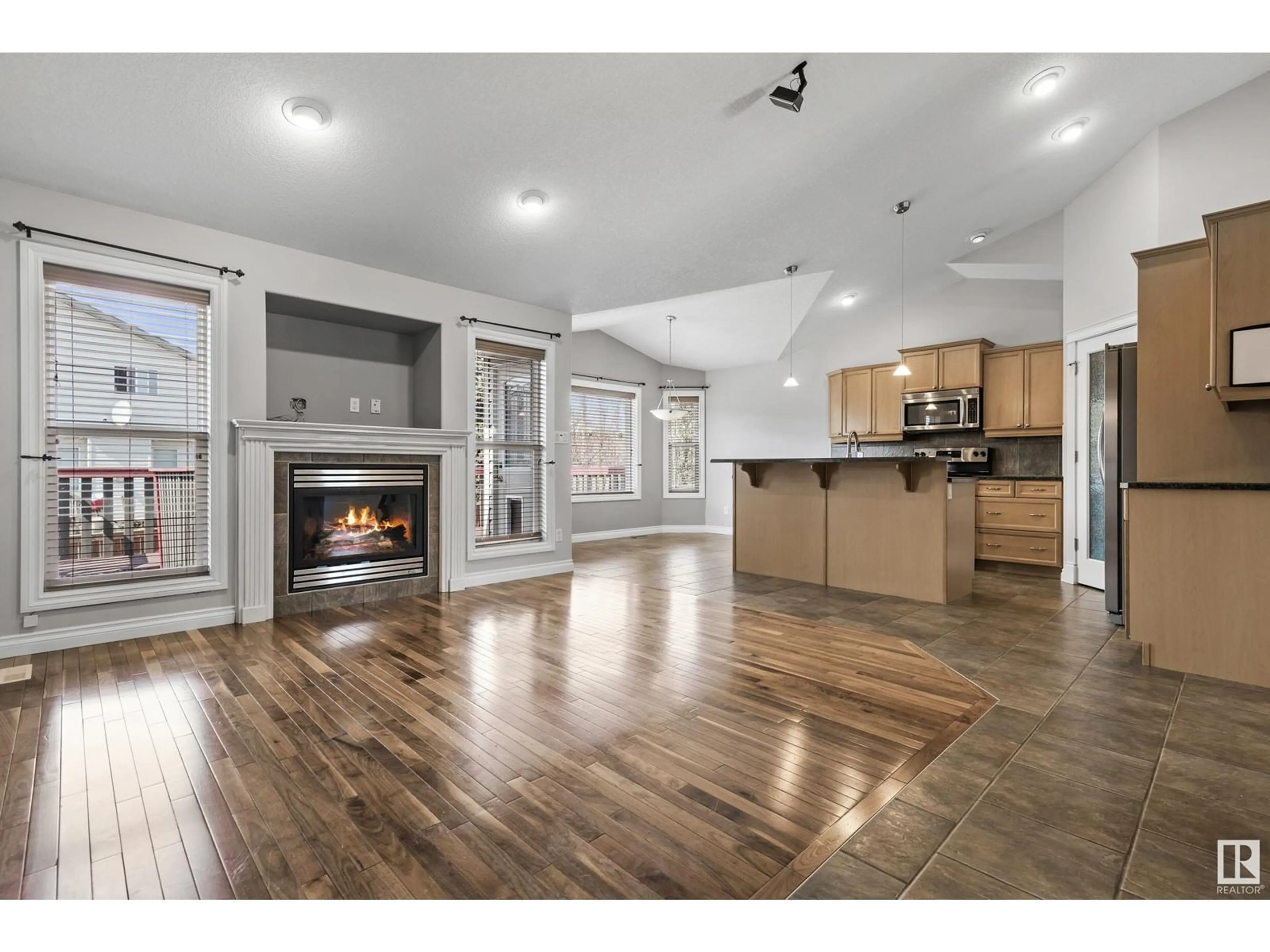 Open concept kitchen, wood/laminate floor for NW - 16228 51 ST, Edmonton Alberta T5Y3K2
