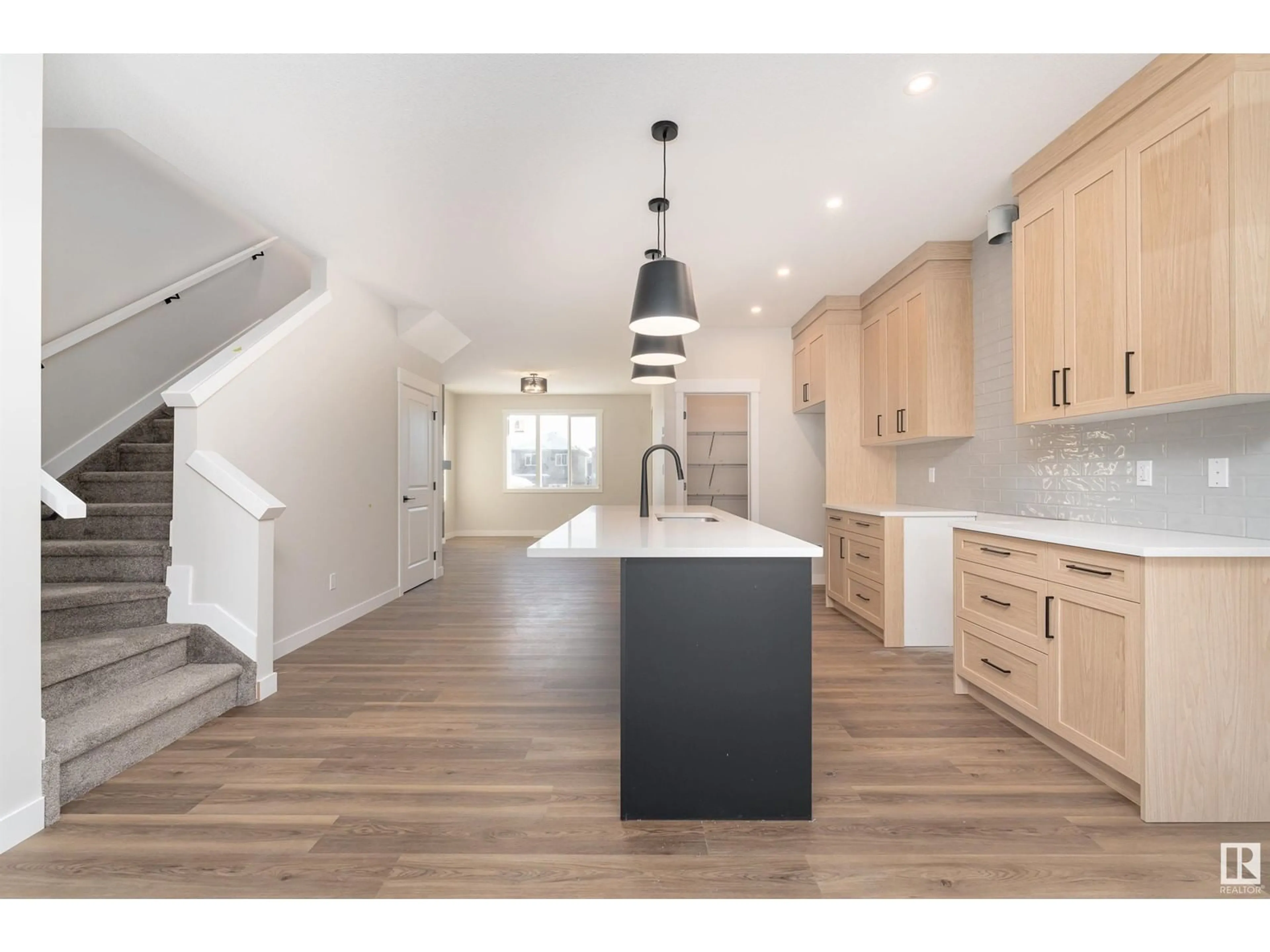 Open concept kitchen, wood/laminate floor for NW - 9351 222 ST, Edmonton Alberta T5T7T1
