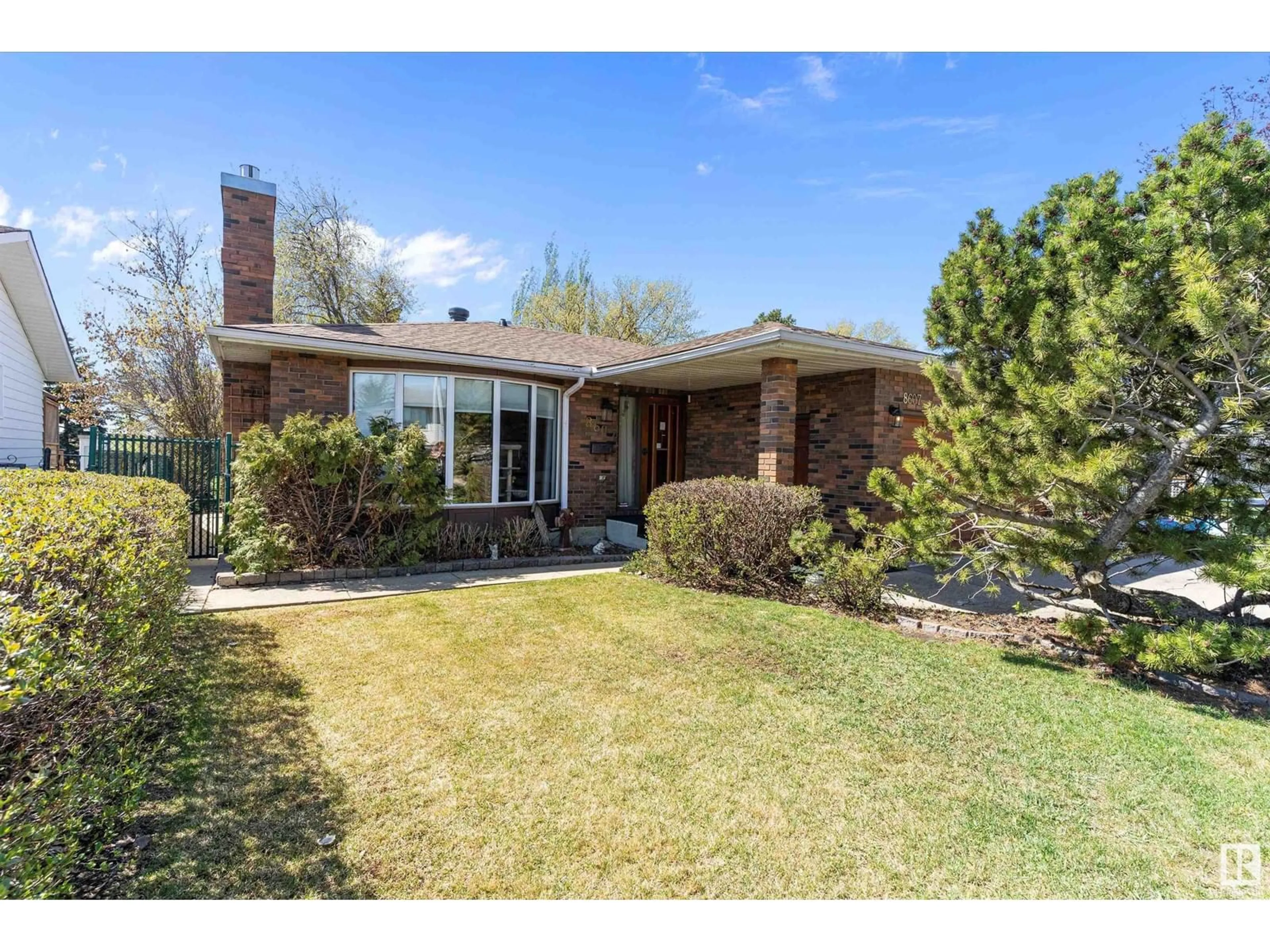 Home with brick exterior material, street for 8607 10 AV, Edmonton Alberta T6K1W9