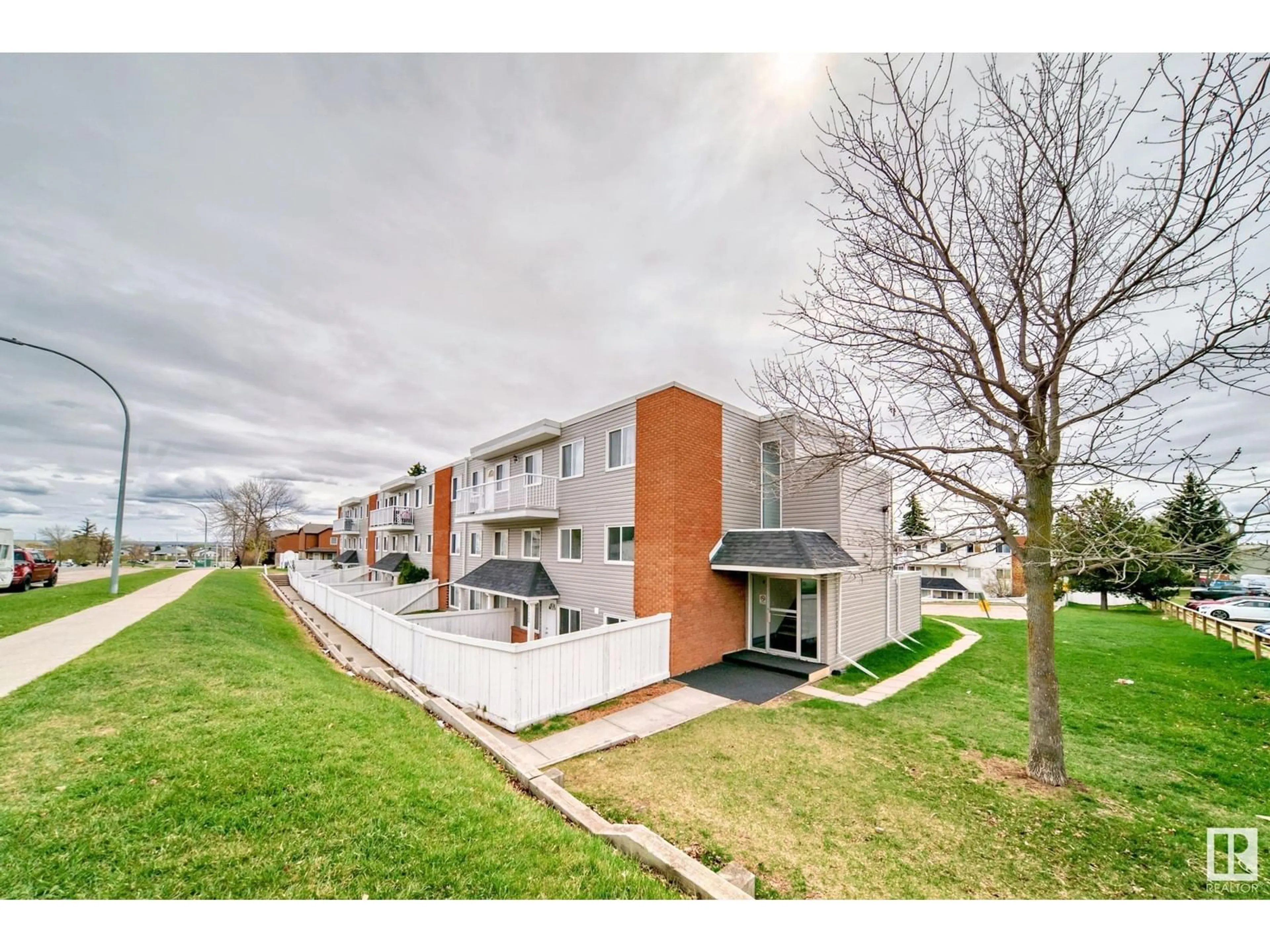 A pic from outside/outdoor area/front of a property/back of a property/a pic from drone, street for #112 - 14530 52 ST, Edmonton Alberta T5A3K5