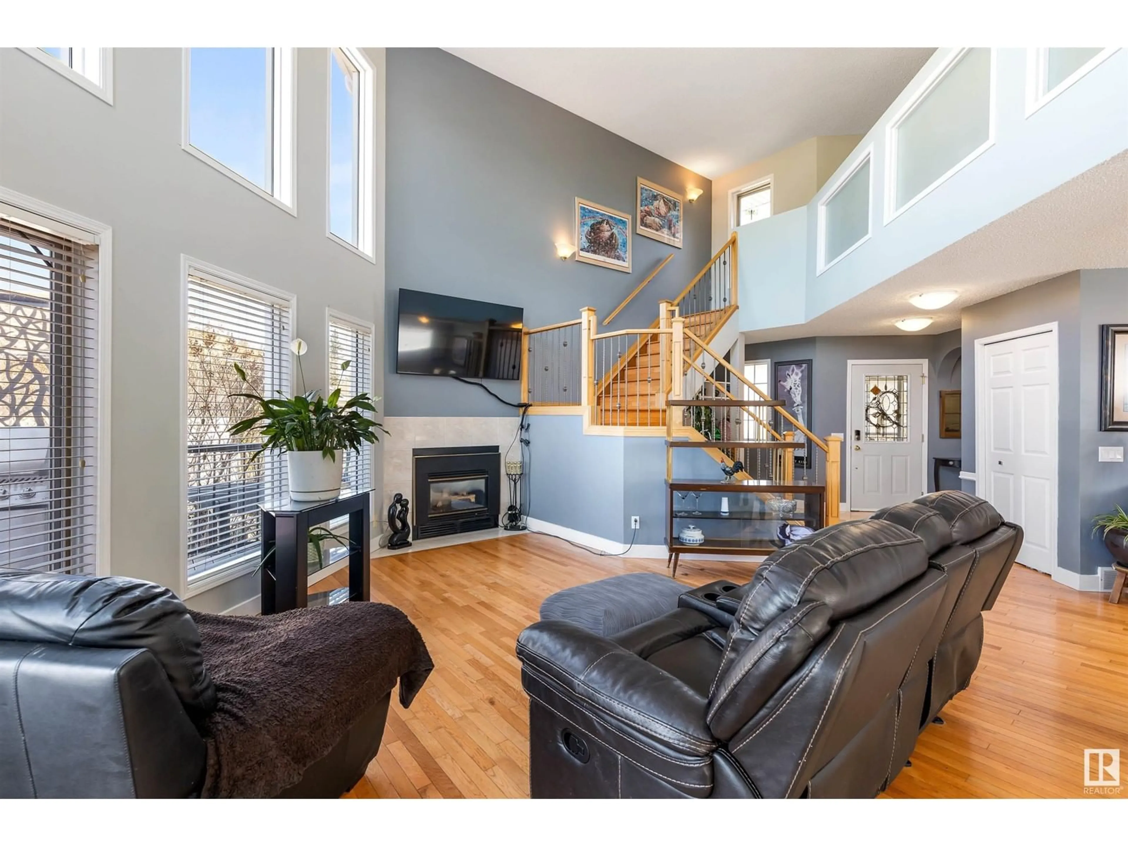 Living room with furniture, wood/laminate floor for 9 AUGUSTA FAIRWAY, Stony Plain Alberta T7Z1M3