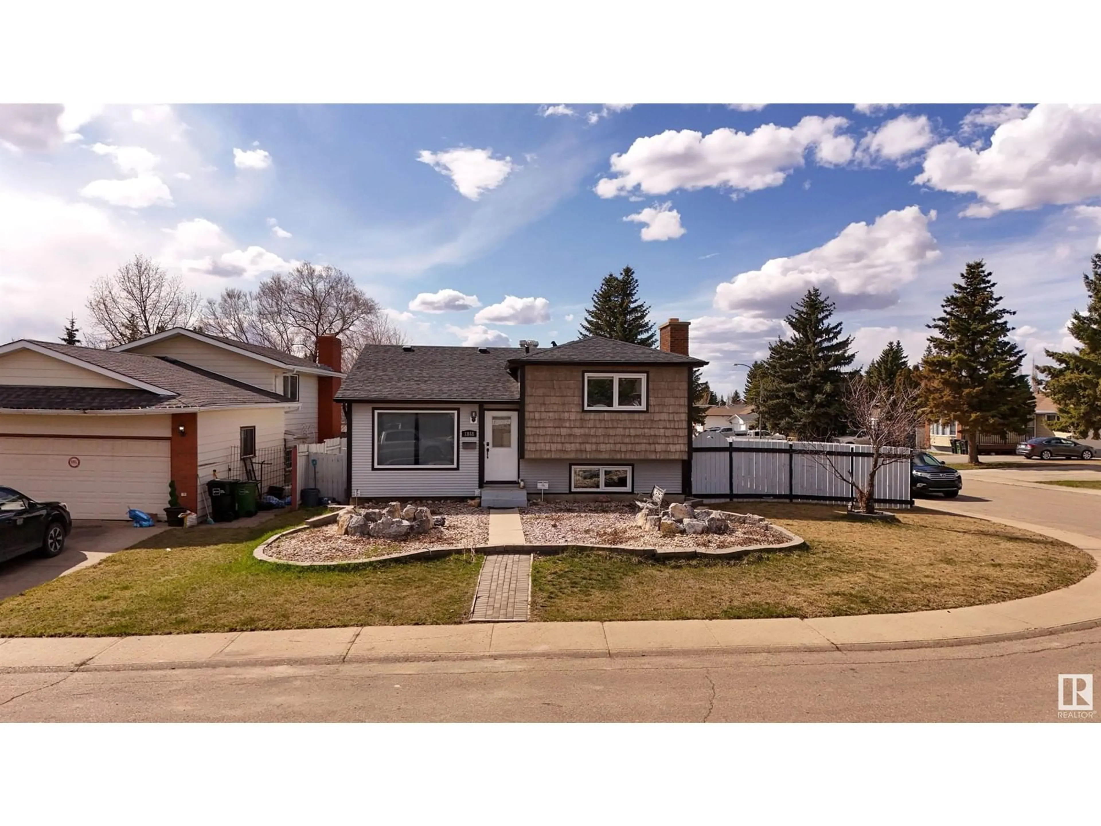 Home with vinyl exterior material, street for NW - 1848 35 ST, Edmonton Alberta T6T3E9