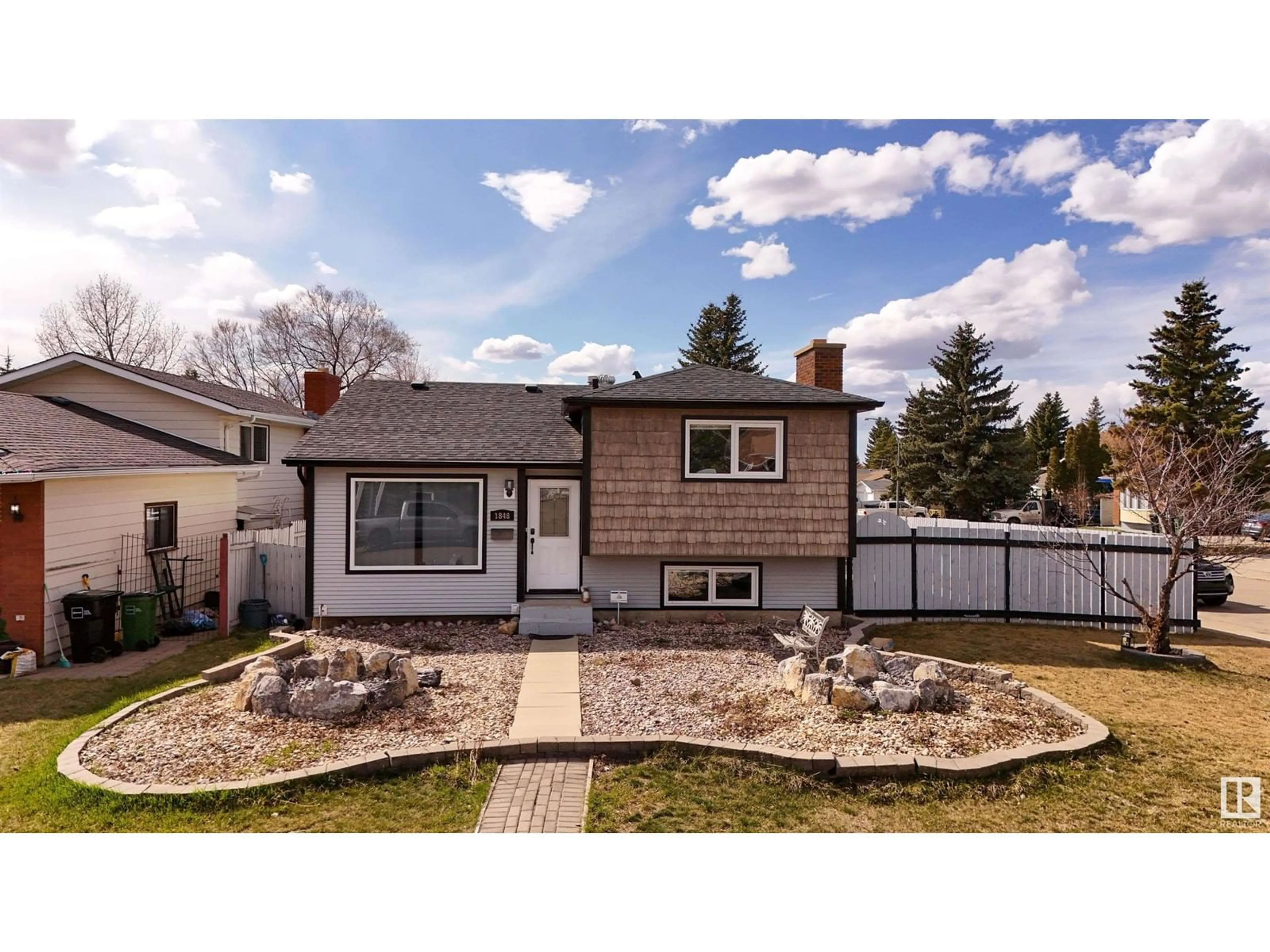 Home with vinyl exterior material, street for NW - 1848 35 ST, Edmonton Alberta T6T3E9