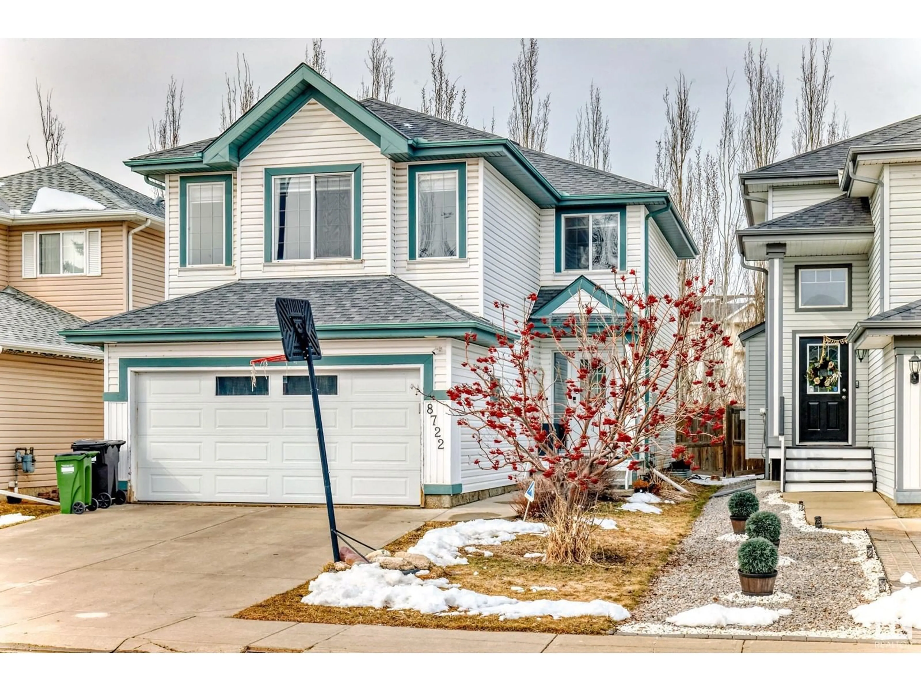 Home with vinyl exterior material, street for 8722 5 AV SW, Edmonton Alberta T6X1E2