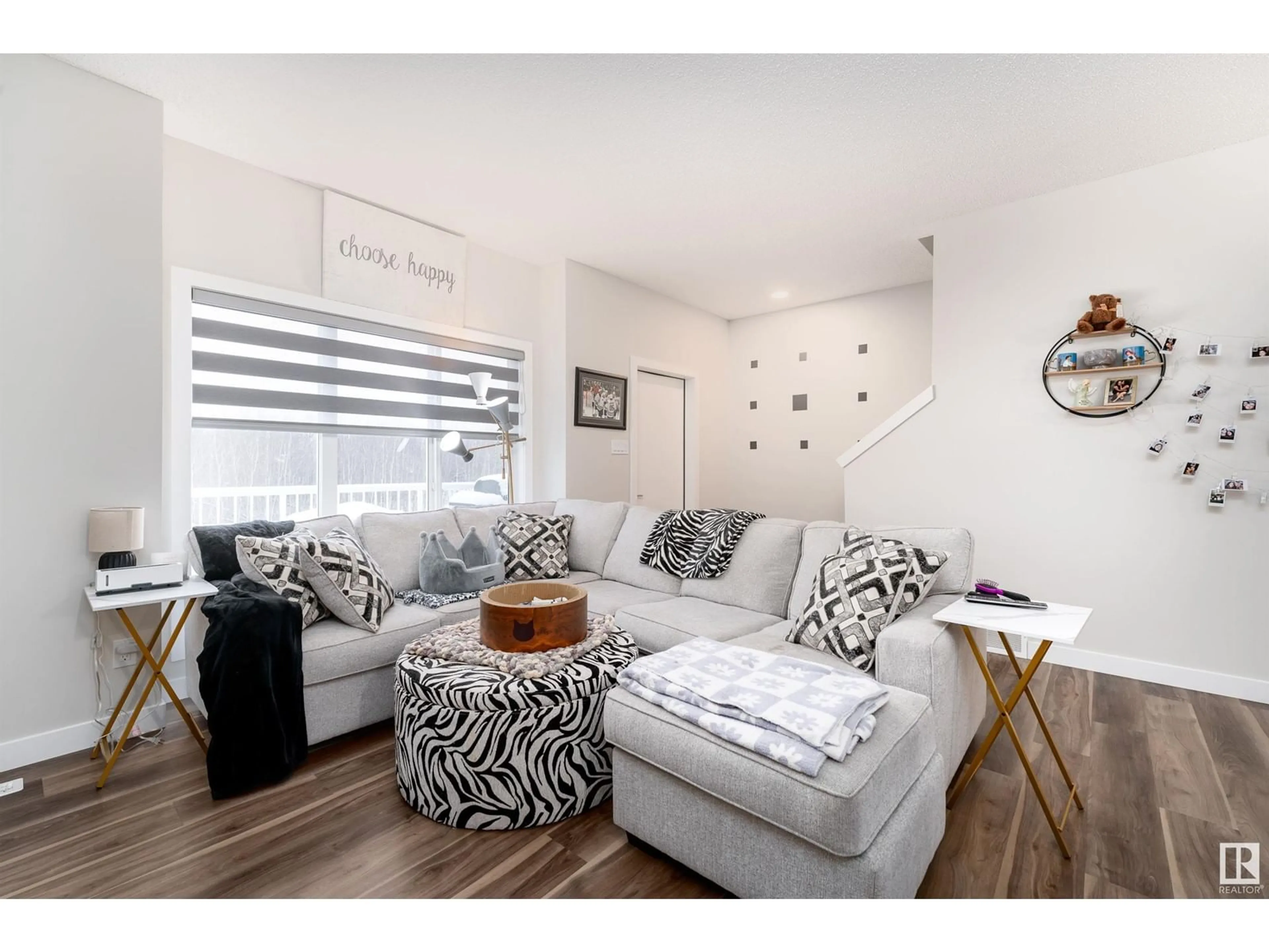 Living room with furniture, wood/laminate floor for 979 - 17 CRYSTALLINA NERA WY, Edmonton Alberta T5Z0S3