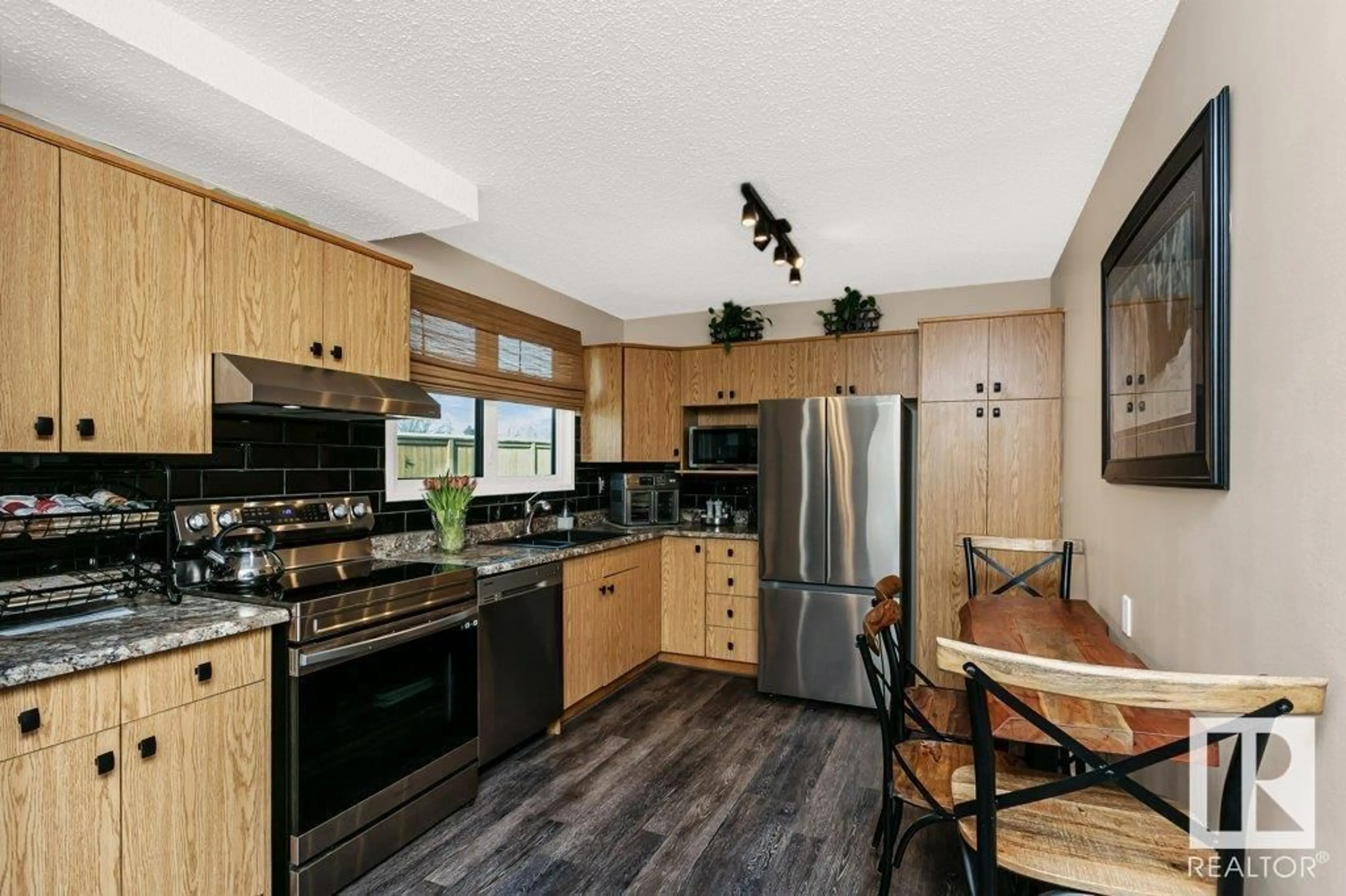 Open concept kitchen, ceramic/tile floor for 5615 137 AV, Edmonton Alberta T5A2H4