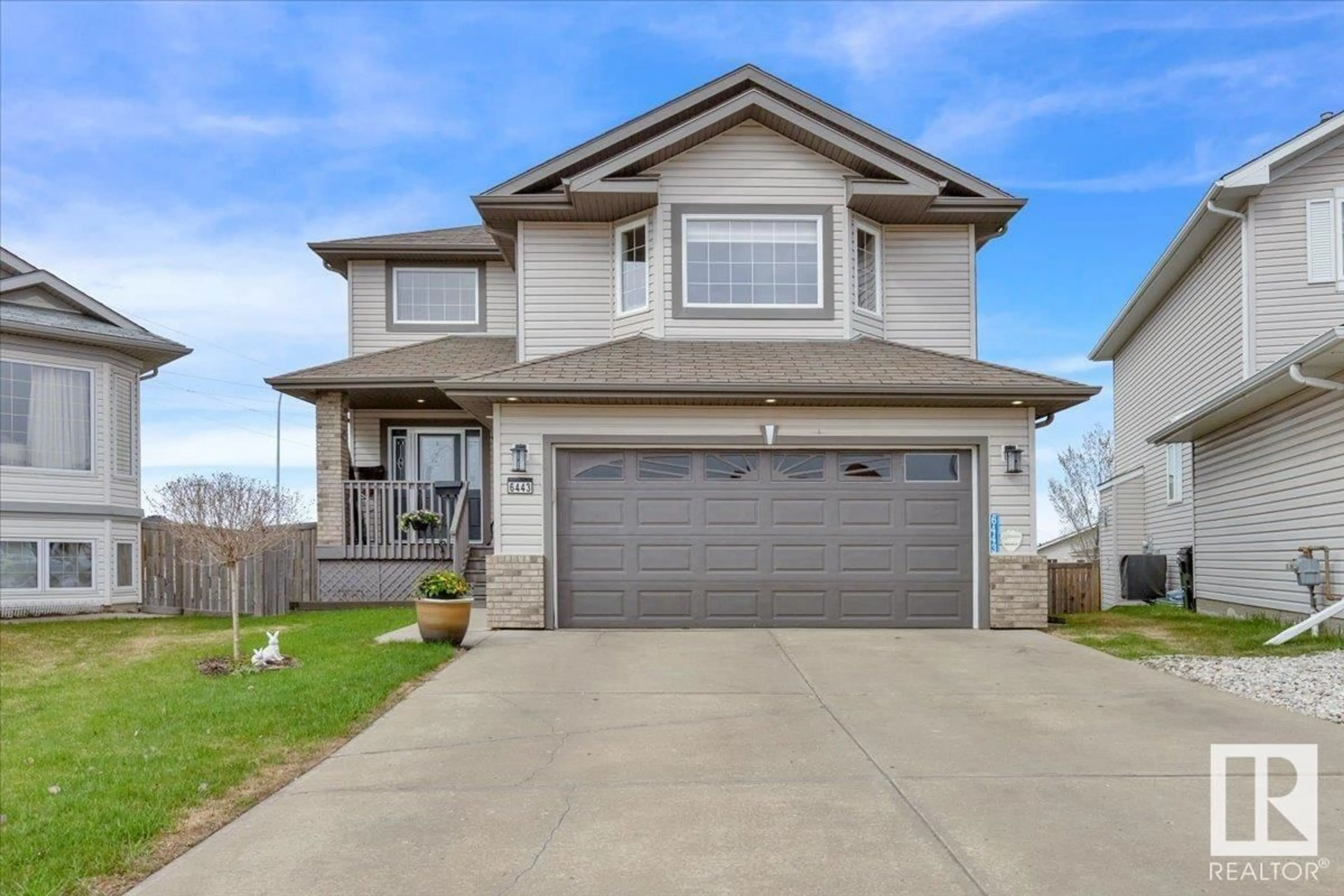 Home with vinyl exterior material, street for 6443 164 AV, Edmonton Alberta T5Y3J2