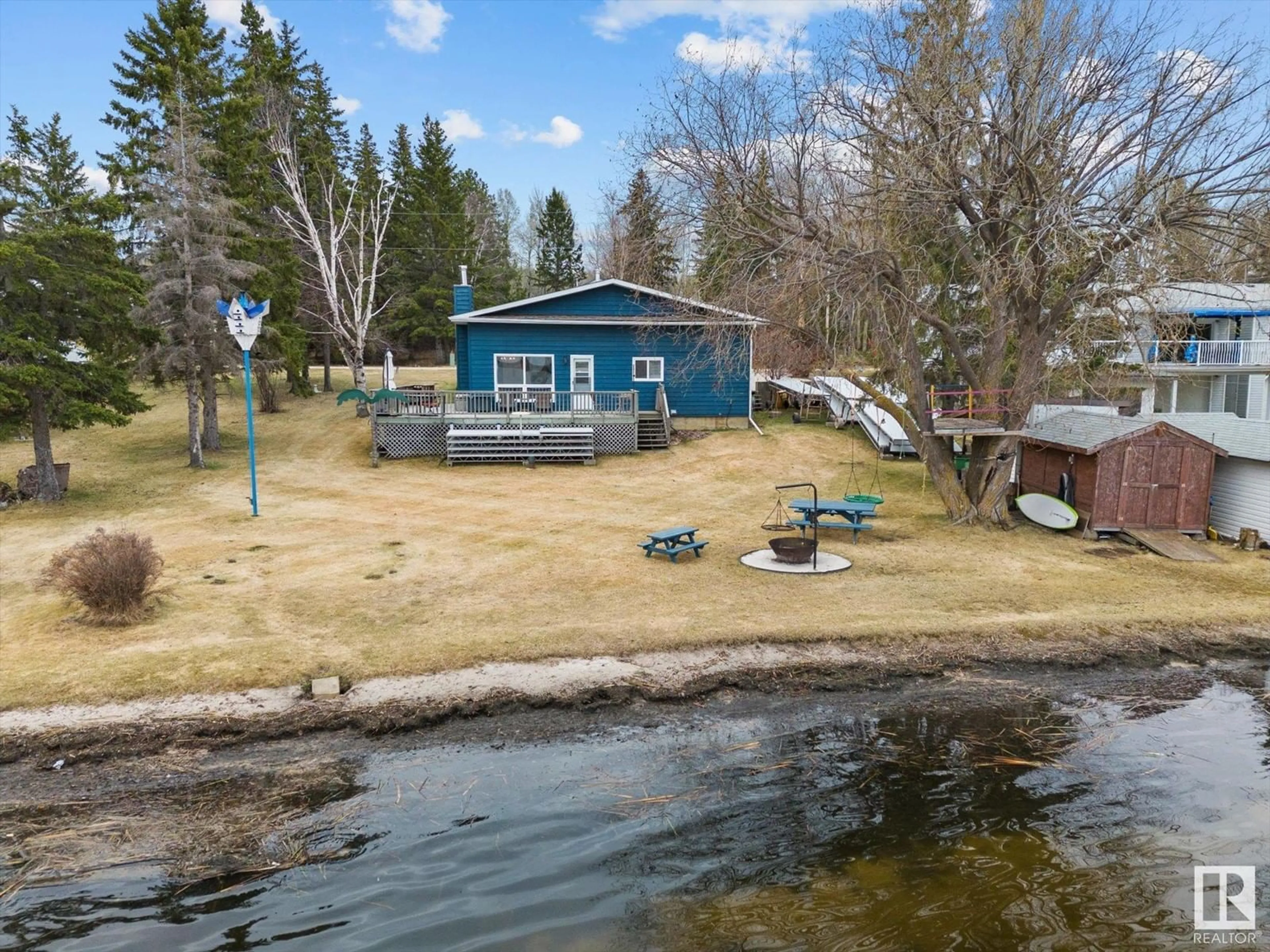 A pic from outside/outdoor area/front of a property/back of a property/a pic from drone, water/lake/river/ocean view for 9 BAY DR, Rural Lac Ste. Anne County Alberta T0E0L0