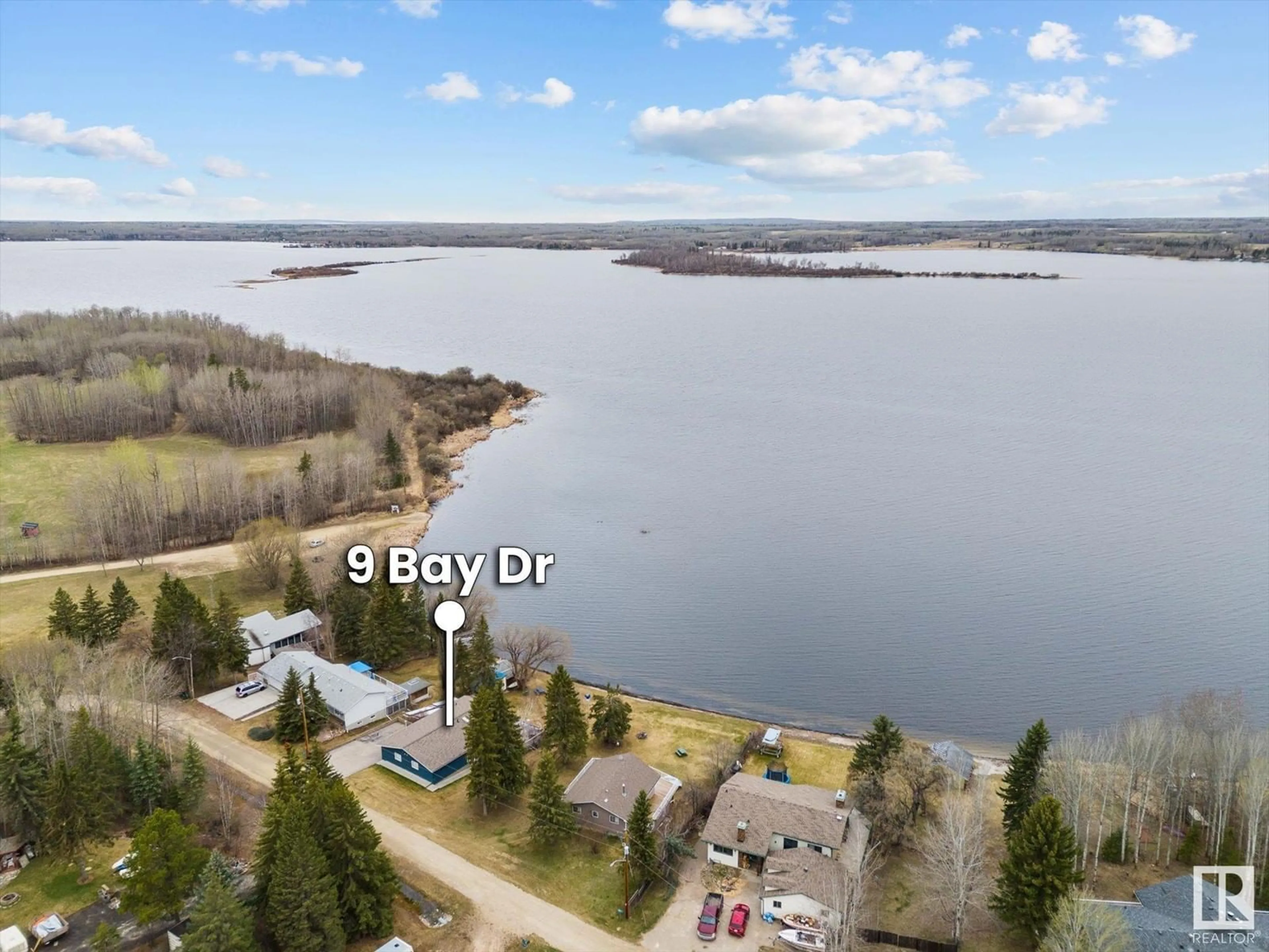 A pic from outside/outdoor area/front of a property/back of a property/a pic from drone, water/lake/river/ocean view for 9 BAY DR, Rural Lac Ste. Anne County Alberta T0E0L0