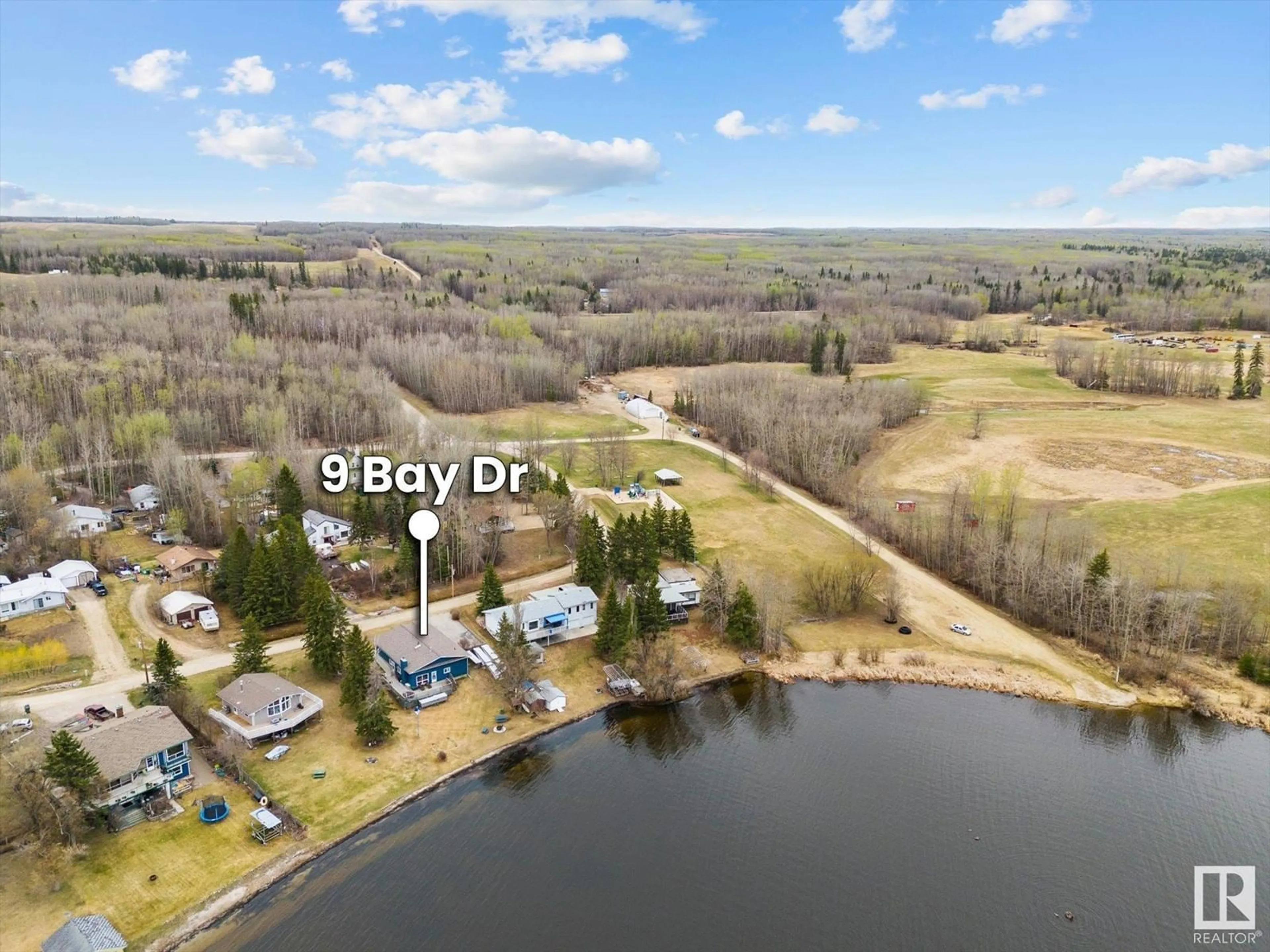A pic from outside/outdoor area/front of a property/back of a property/a pic from drone, water/lake/river/ocean view for 9 BAY DR, Rural Lac Ste. Anne County Alberta T0E0L0