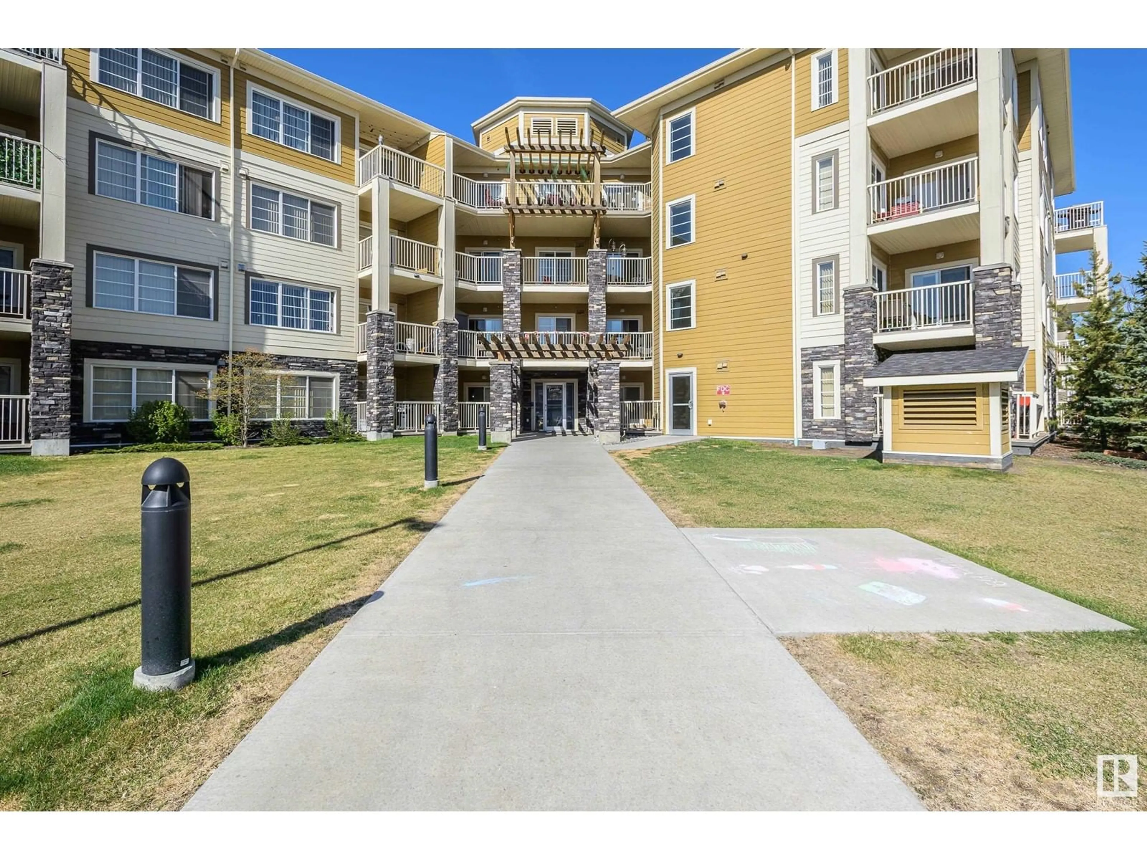 A pic from outside/outdoor area/front of a property/back of a property/a pic from drone, unknown for #306 - 3670 139 AV, Edmonton Alberta T5Y3N5