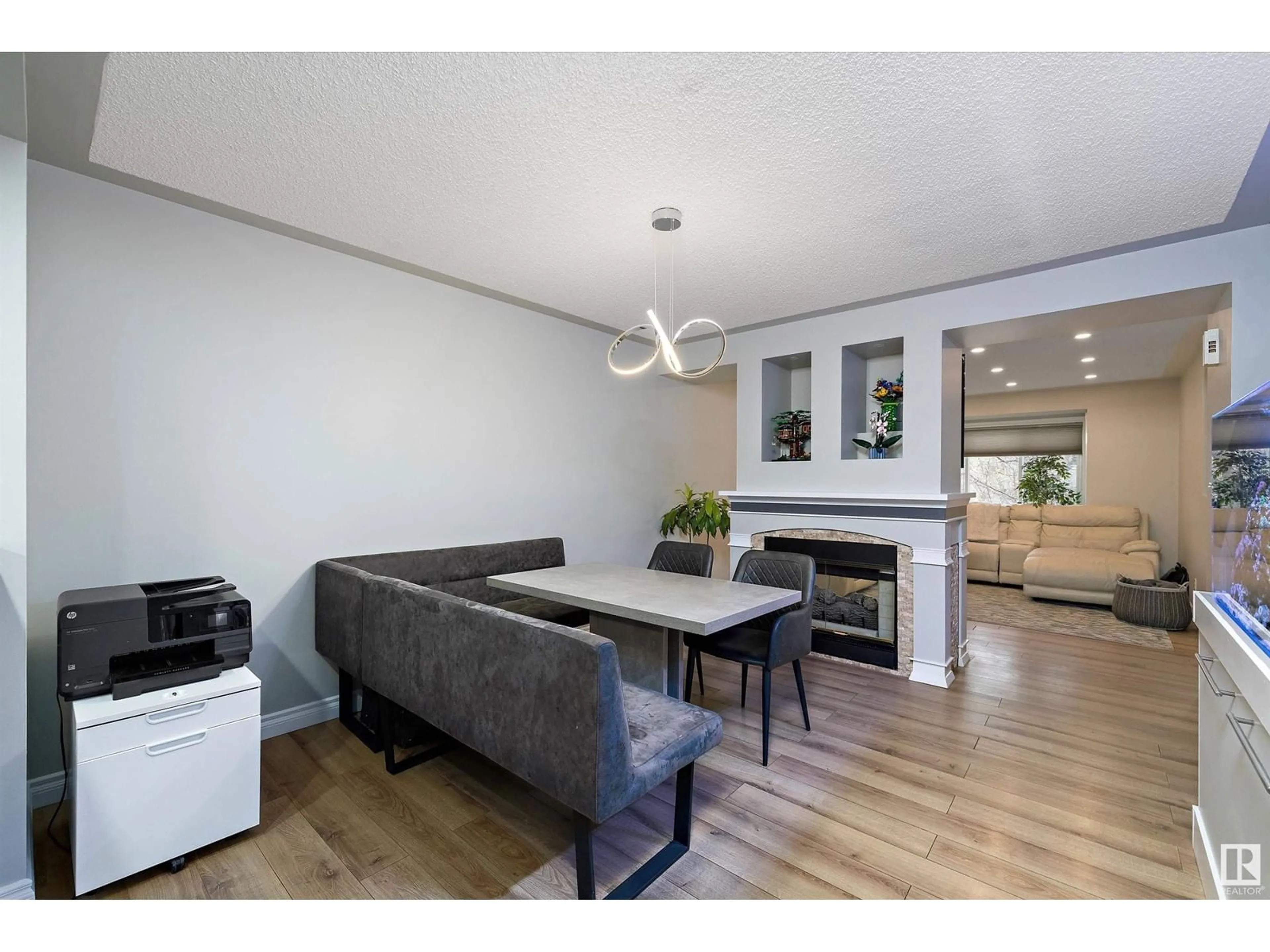 Living room with furniture, wood/laminate floor for NW - 9323 98 AV, Edmonton Alberta T6C2C6