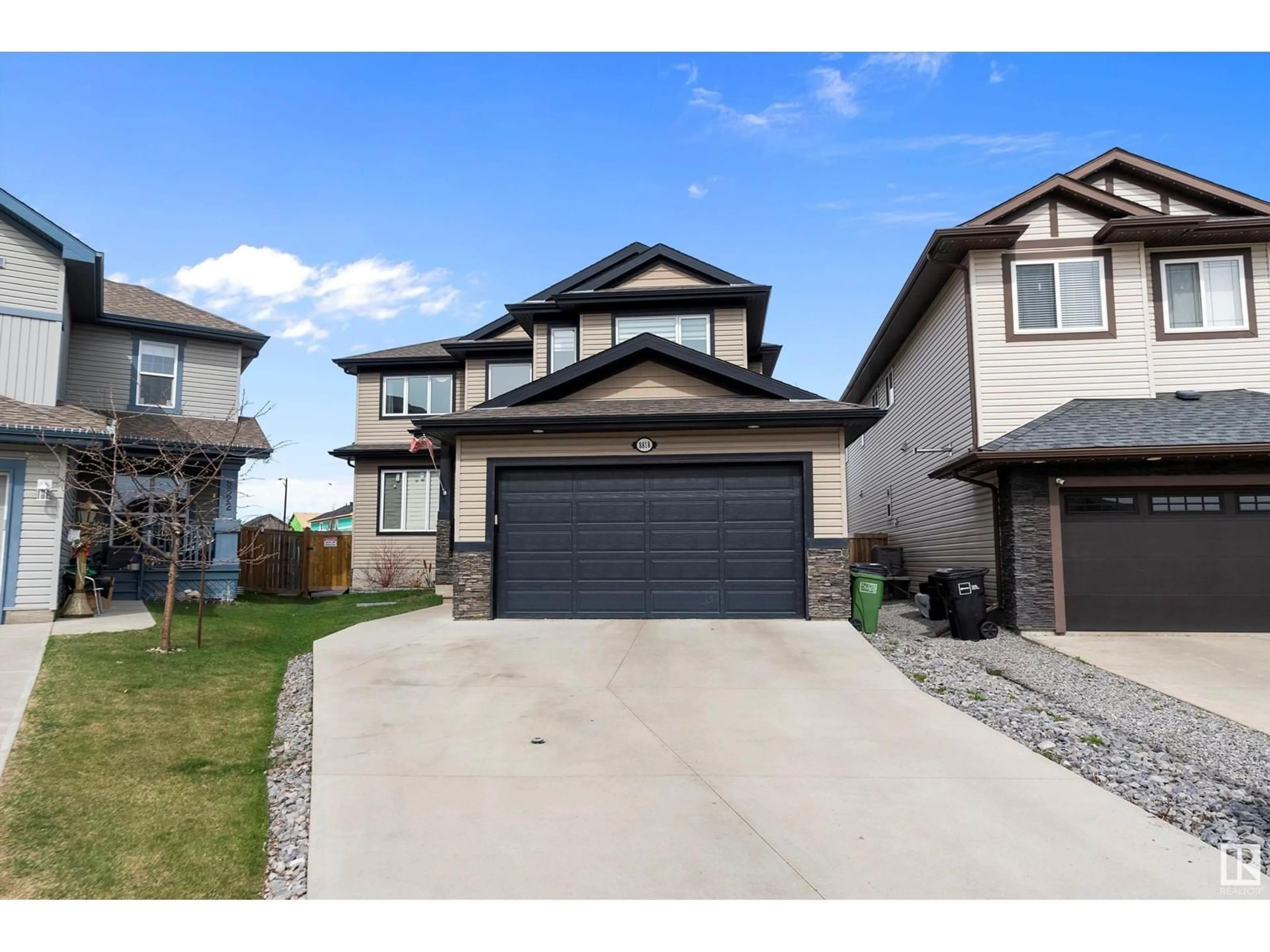 Home with vinyl exterior material, street for NW - 8818 180A AV, Edmonton Alberta T5Z0J4
