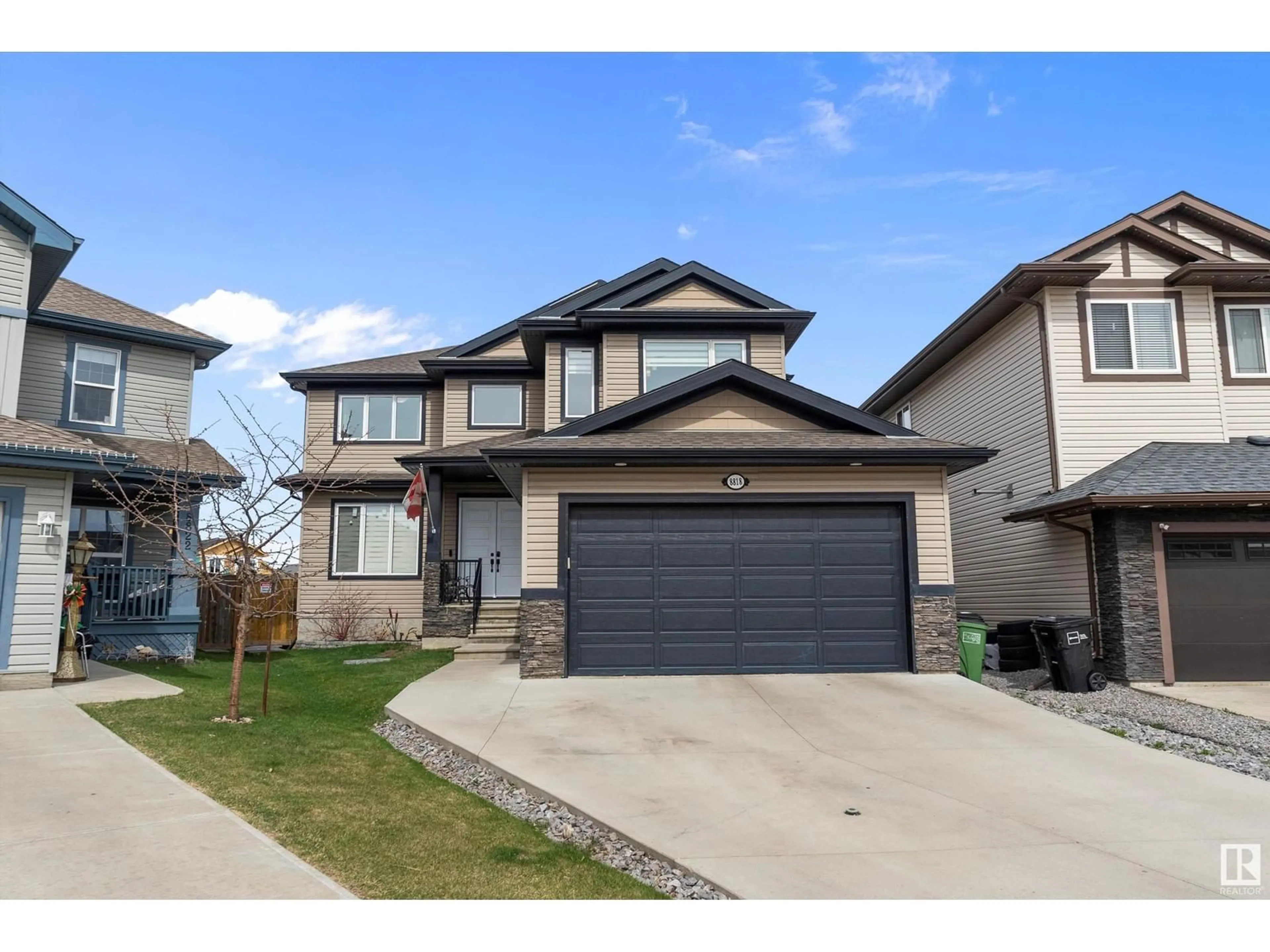 Home with vinyl exterior material, street for NW - 8818 180A AV, Edmonton Alberta T5Z0J4