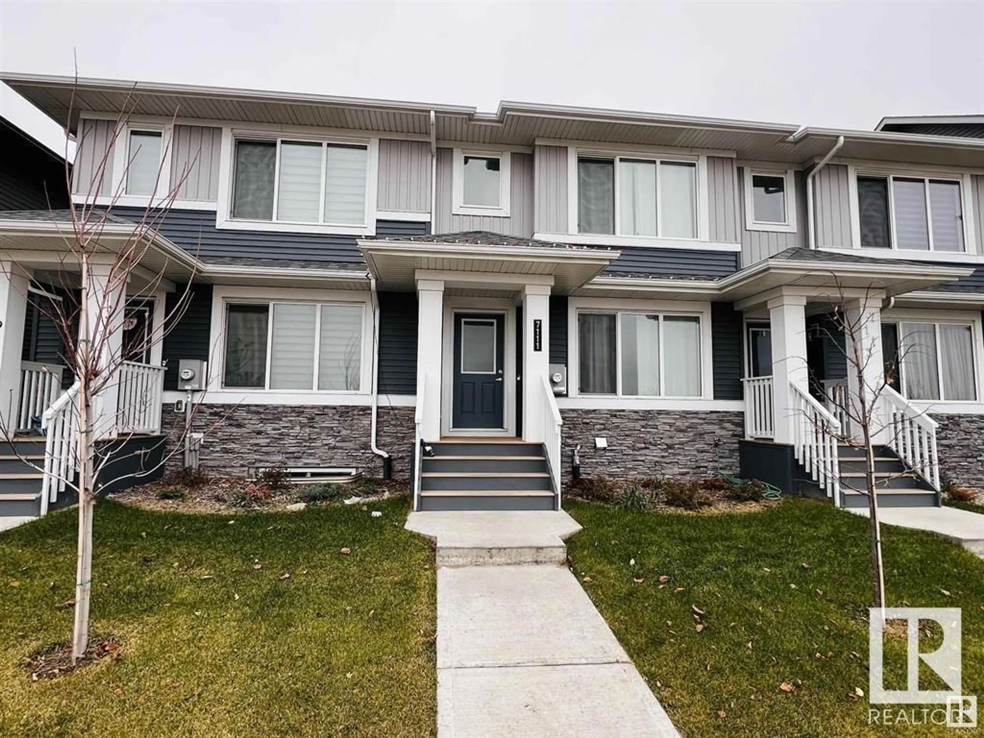 Home with vinyl exterior material, street for NW - 7111 178 AV, Edmonton Alberta T5Z0T4