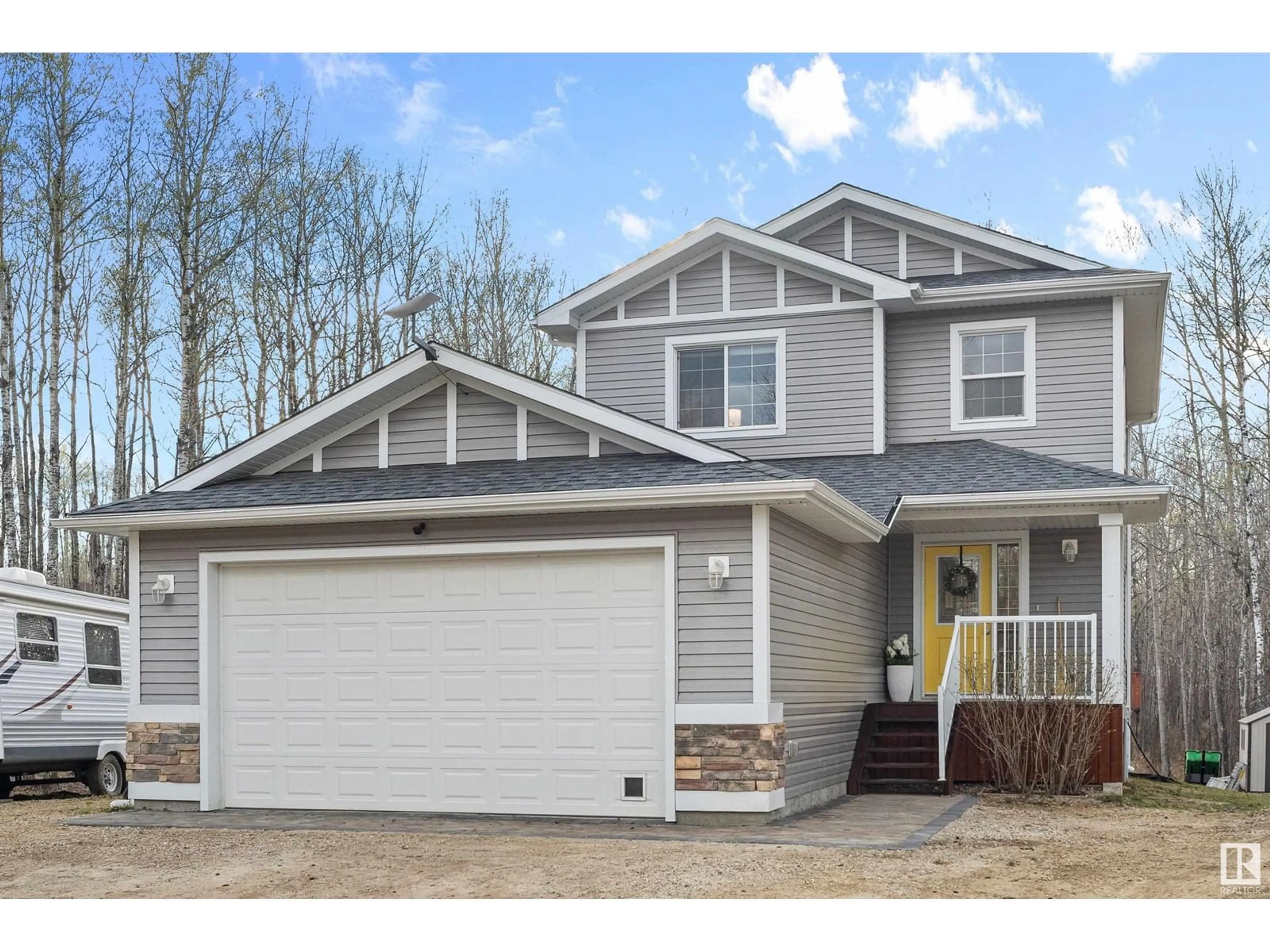 Home with vinyl exterior material, street for 54514 - 24 RGE ROAD 12, Rural Lac Ste. Anne County Alberta T0E1V2