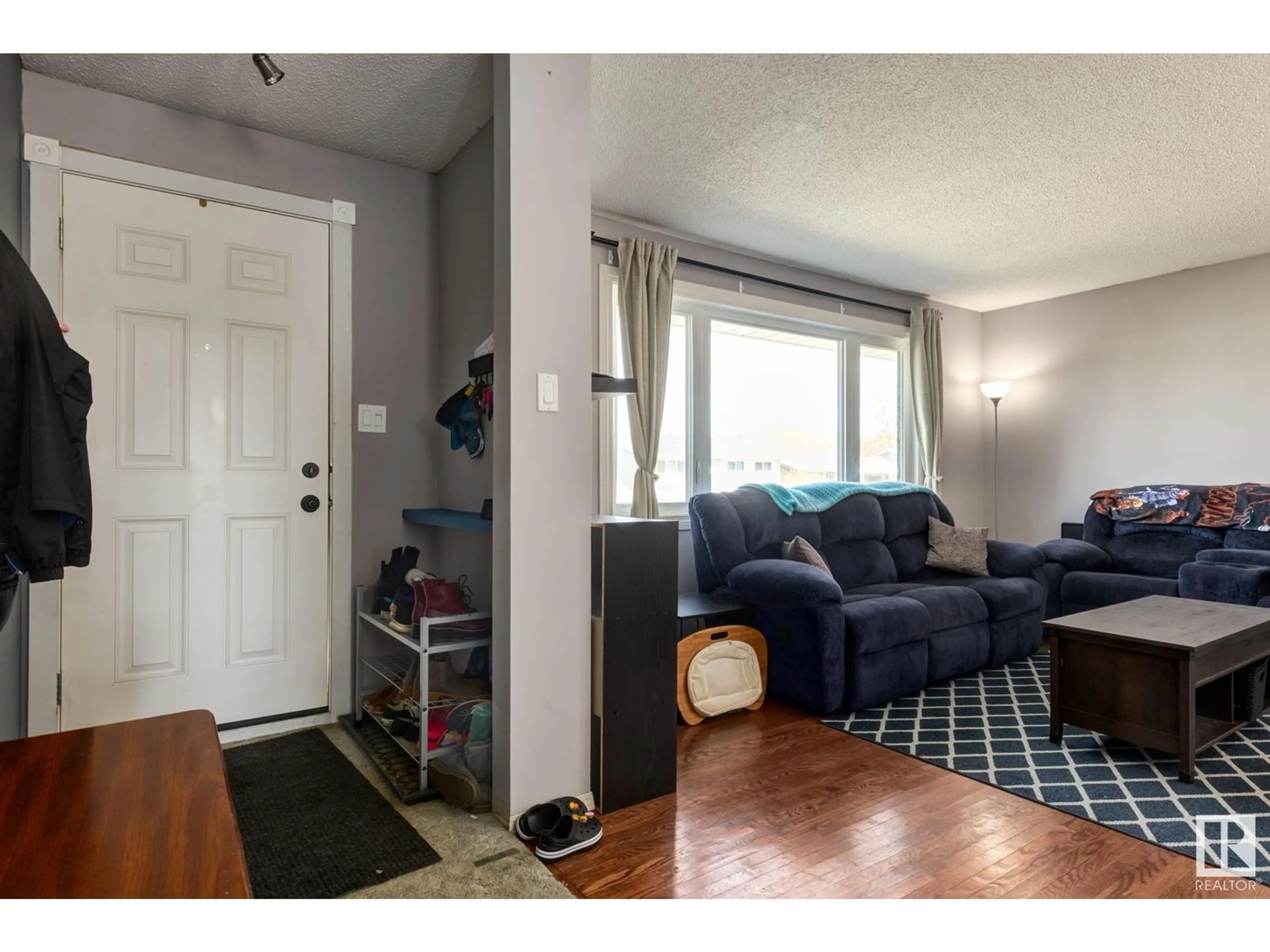 Living room with furniture, unknown for 3511 105 AV, Edmonton Alberta T5W0B6