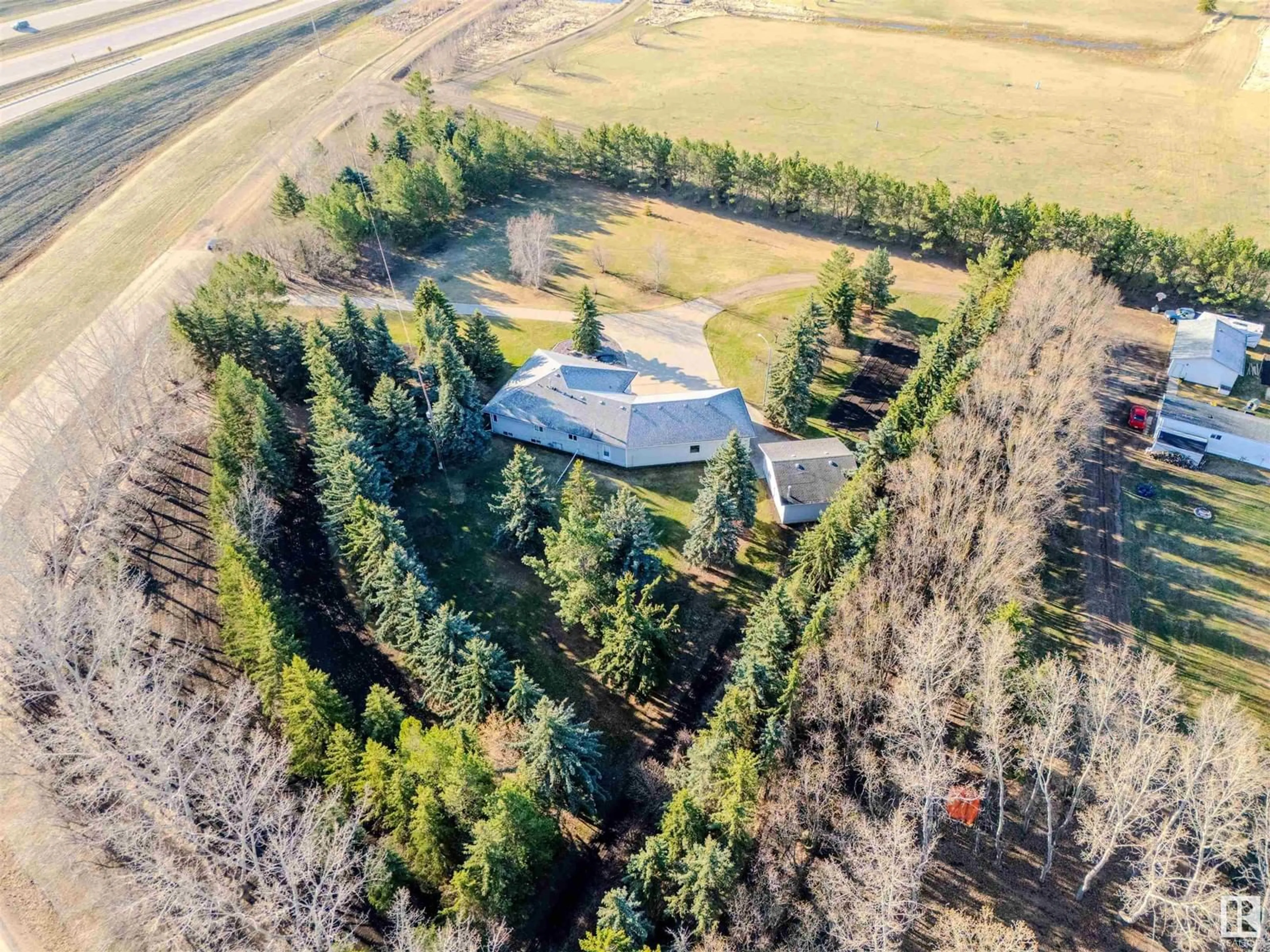 A pic from outside/outdoor area/front of a property/back of a property/a pic from drone, forest/trees view for 25415 - 29 HWY 37, Rural Sturgeon County Alberta T8T0C6