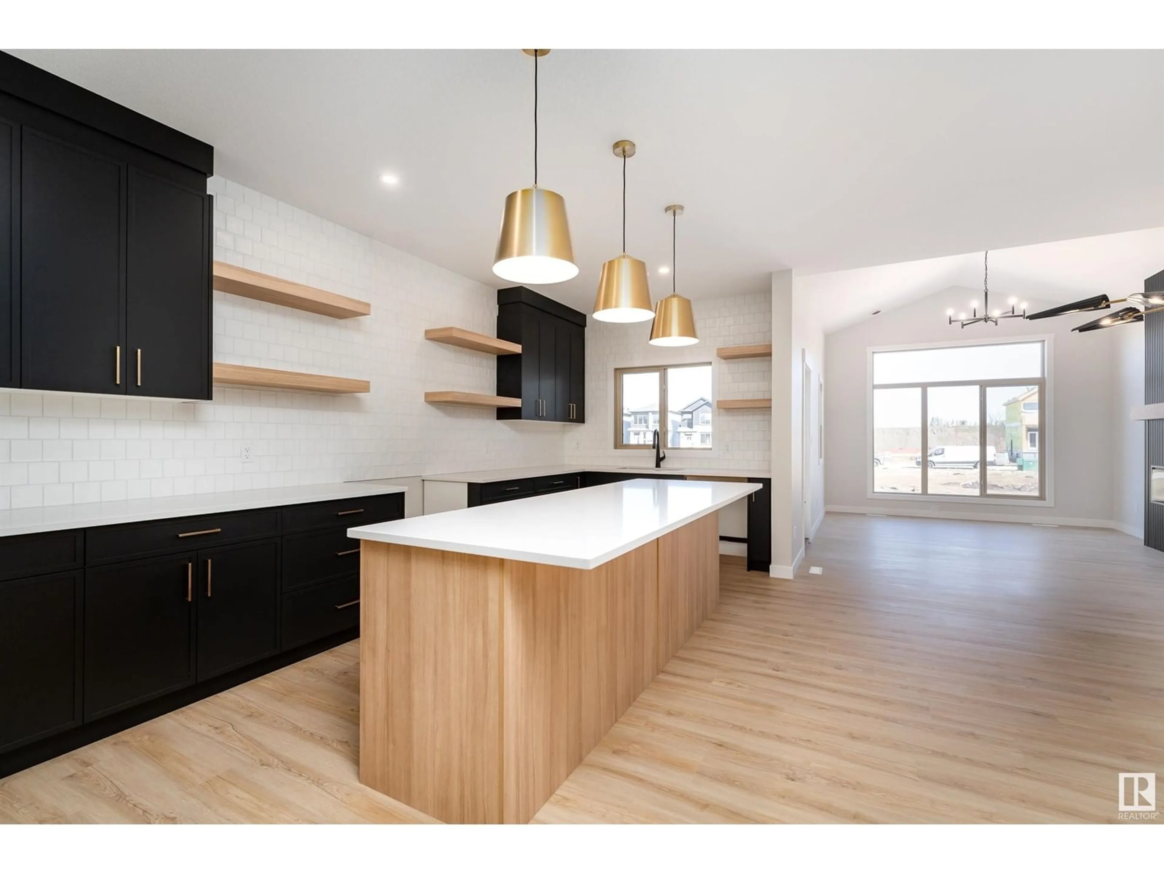 Open concept kitchen, wood/laminate floor for 70 GLADSTONE BN, Spruce Grove Alberta T7X2X6