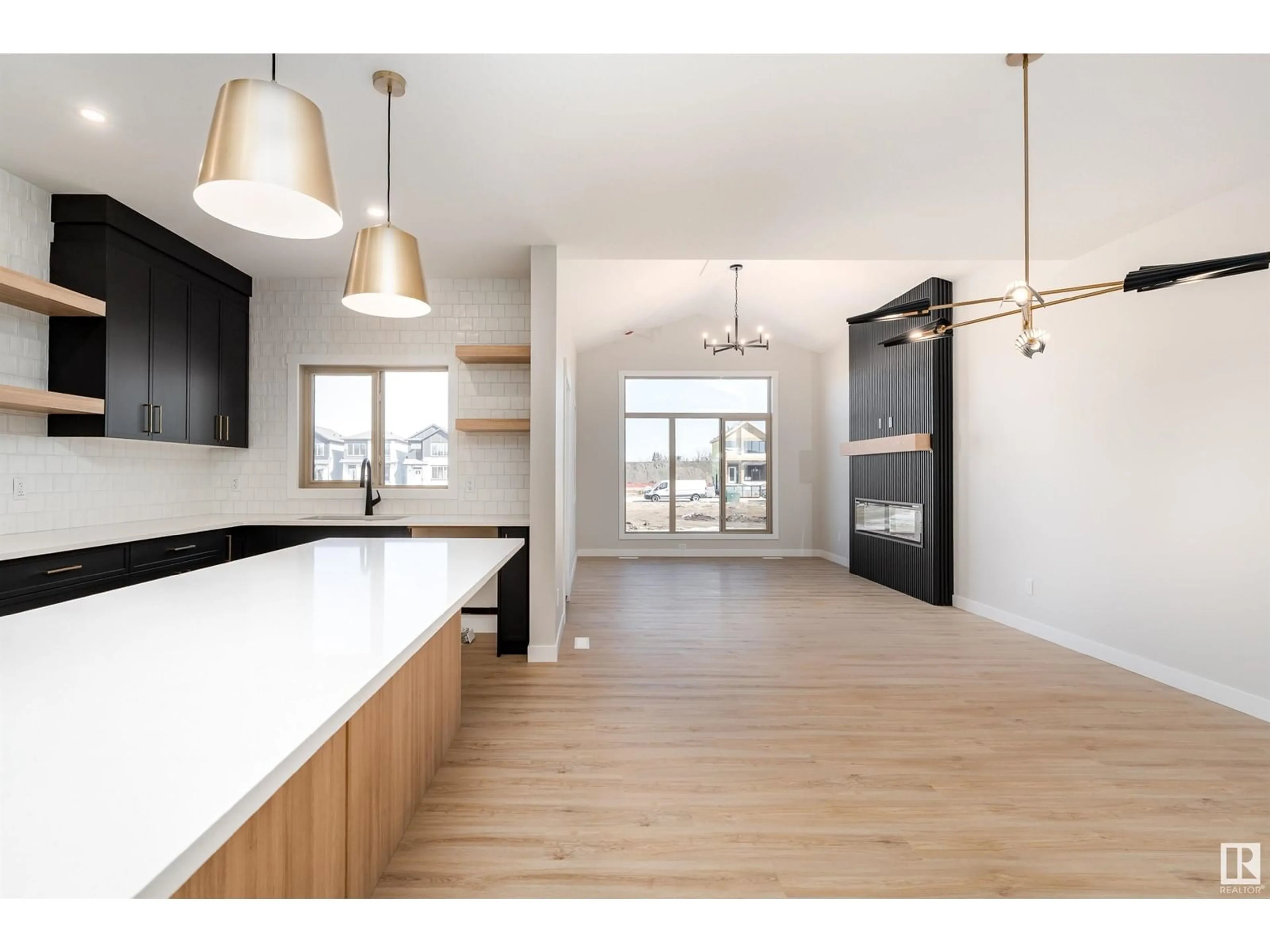 Open concept kitchen, wood/laminate floor for 70 GLADSTONE BN, Spruce Grove Alberta T7X2X6