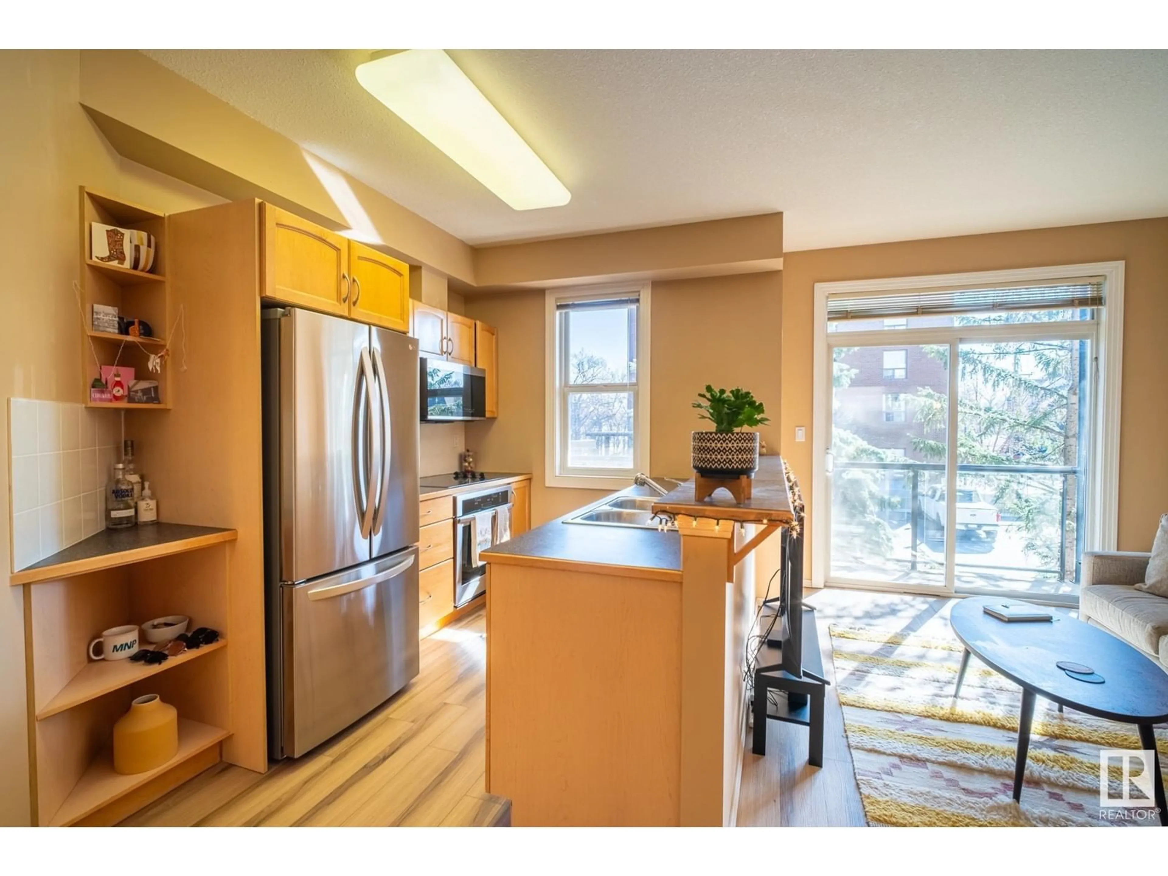 Open concept kitchen, wood/laminate floor for 205 8619 111 ST NW, Edmonton Alberta T6W2W1