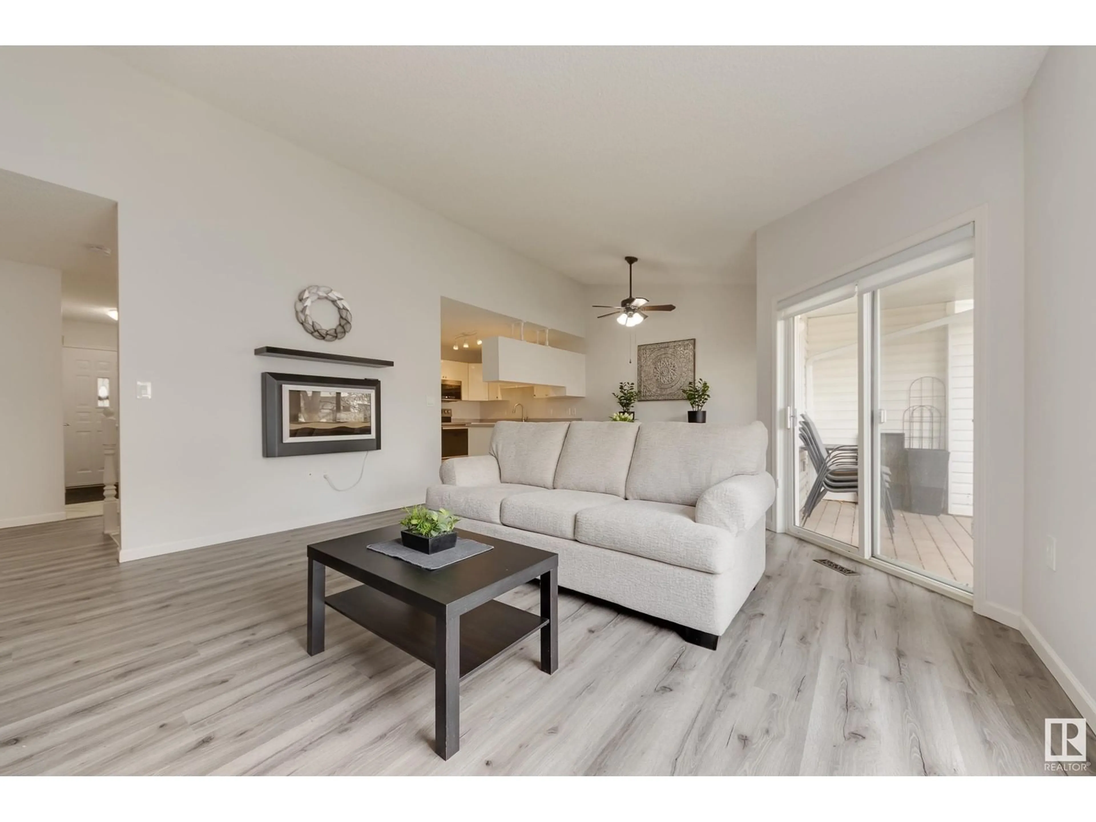 Living room with furniture, wood/laminate floor for #34 - 13217 155 AV, Edmonton Alberta T6V1E6