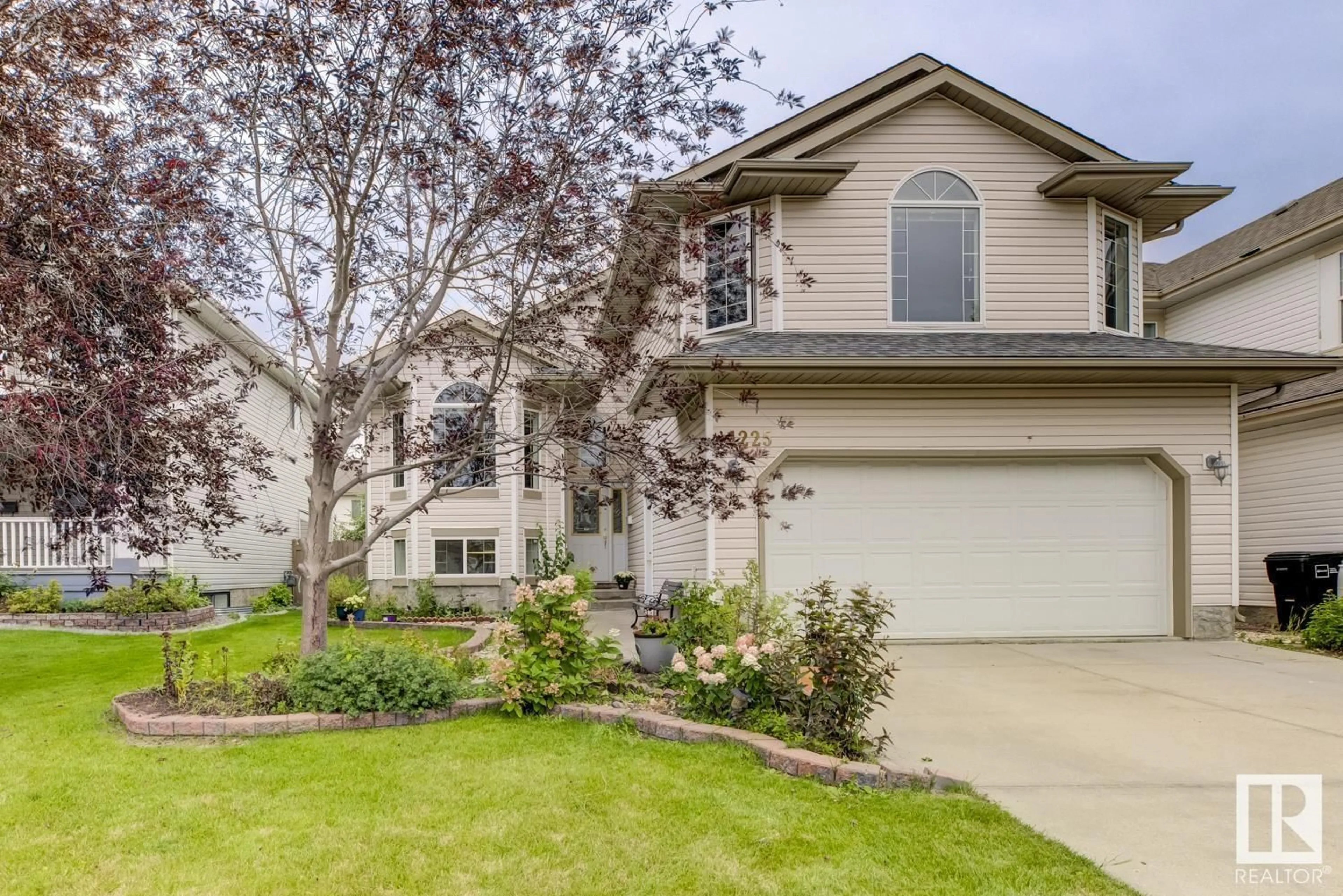 Home with vinyl exterior material, street for NW - 1225 118A ST, Edmonton Alberta T6J7E9