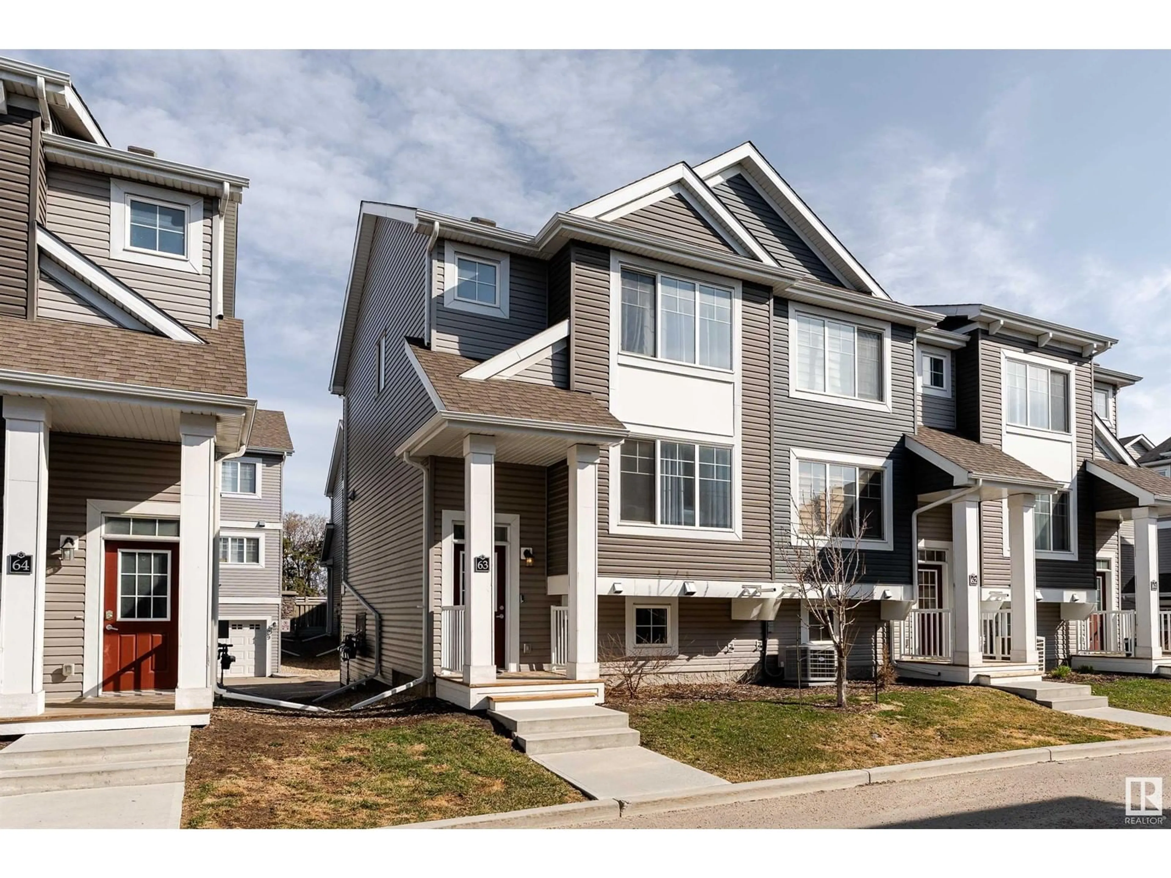 Home with vinyl exterior material, street for #63 - 1391 STARLING DR, Edmonton Alberta T5S0L3