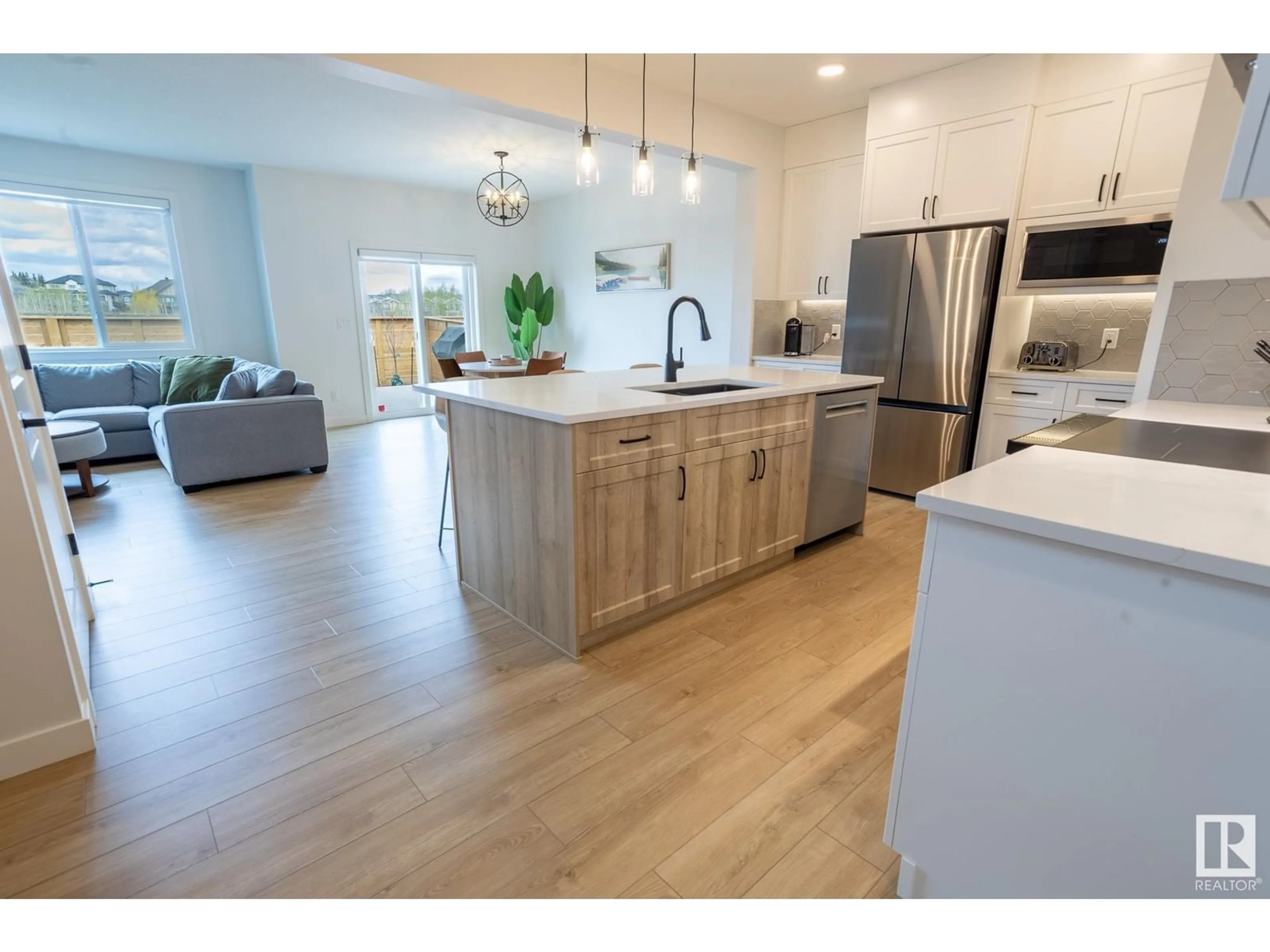 Open concept kitchen, wood/laminate floor for 55 RASPBERRY RD, St. Albert Alberta T8N8A3